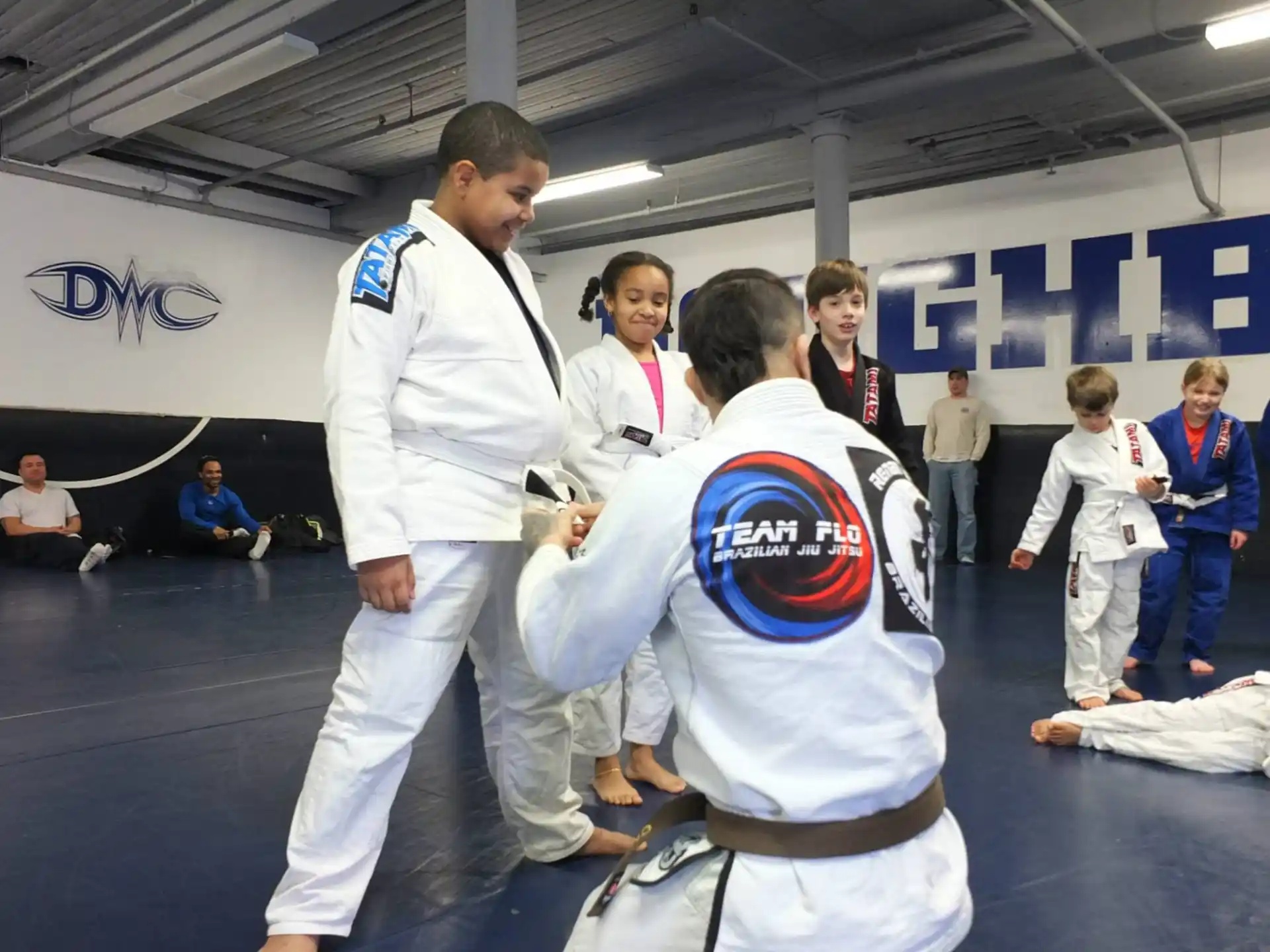 a man and a boy in karate uniforms