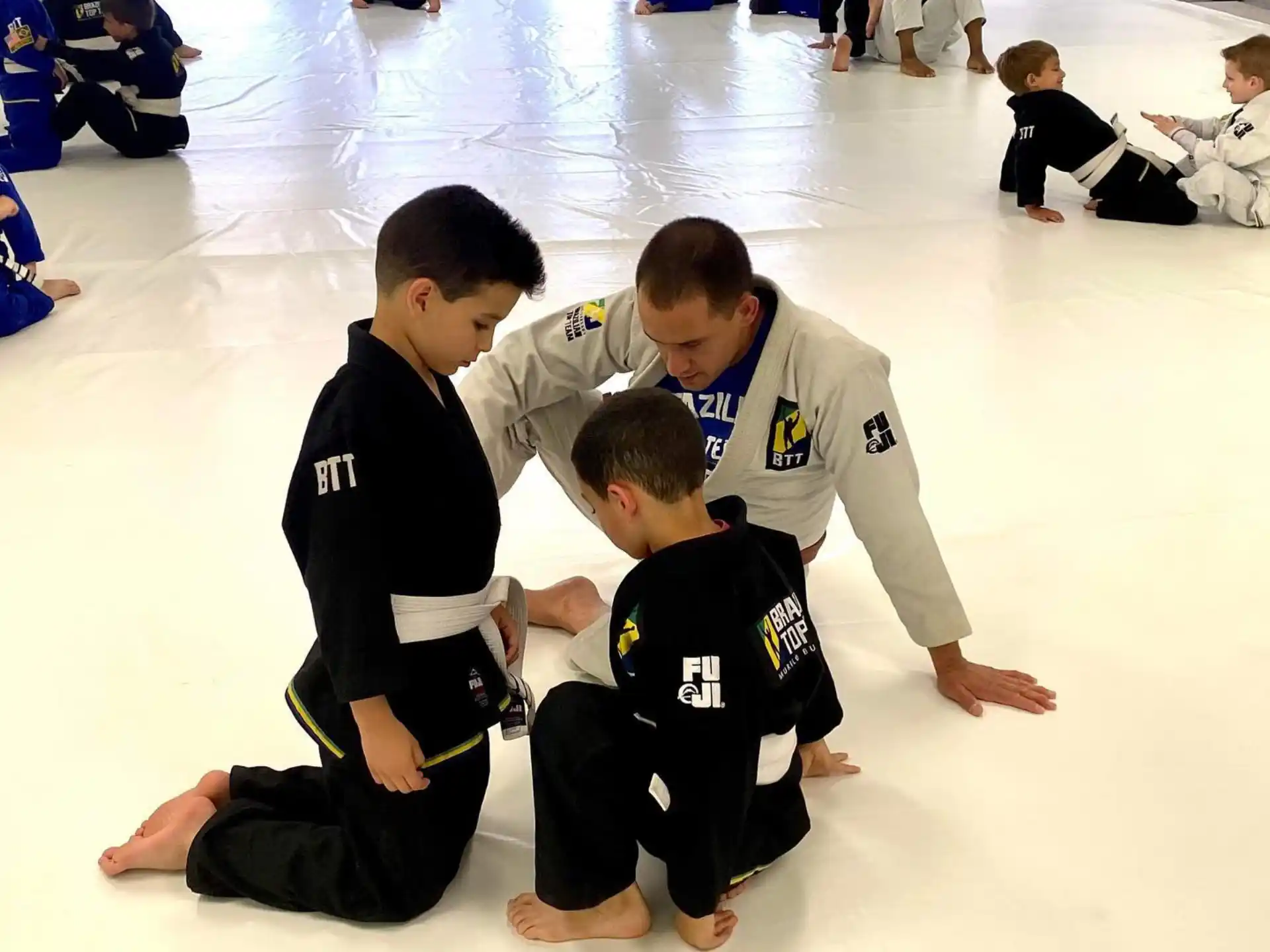 a group of people kneeling on the floor
