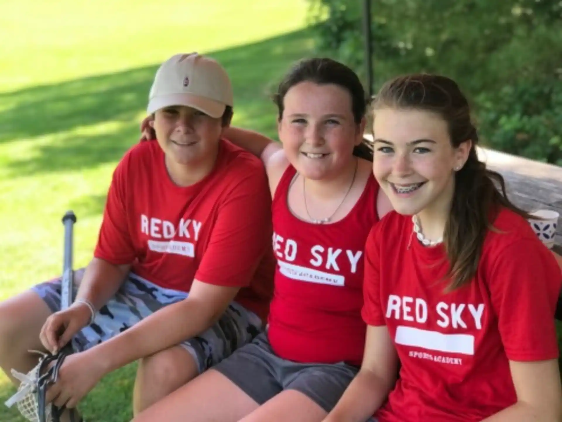 a group of people wearing red shirts