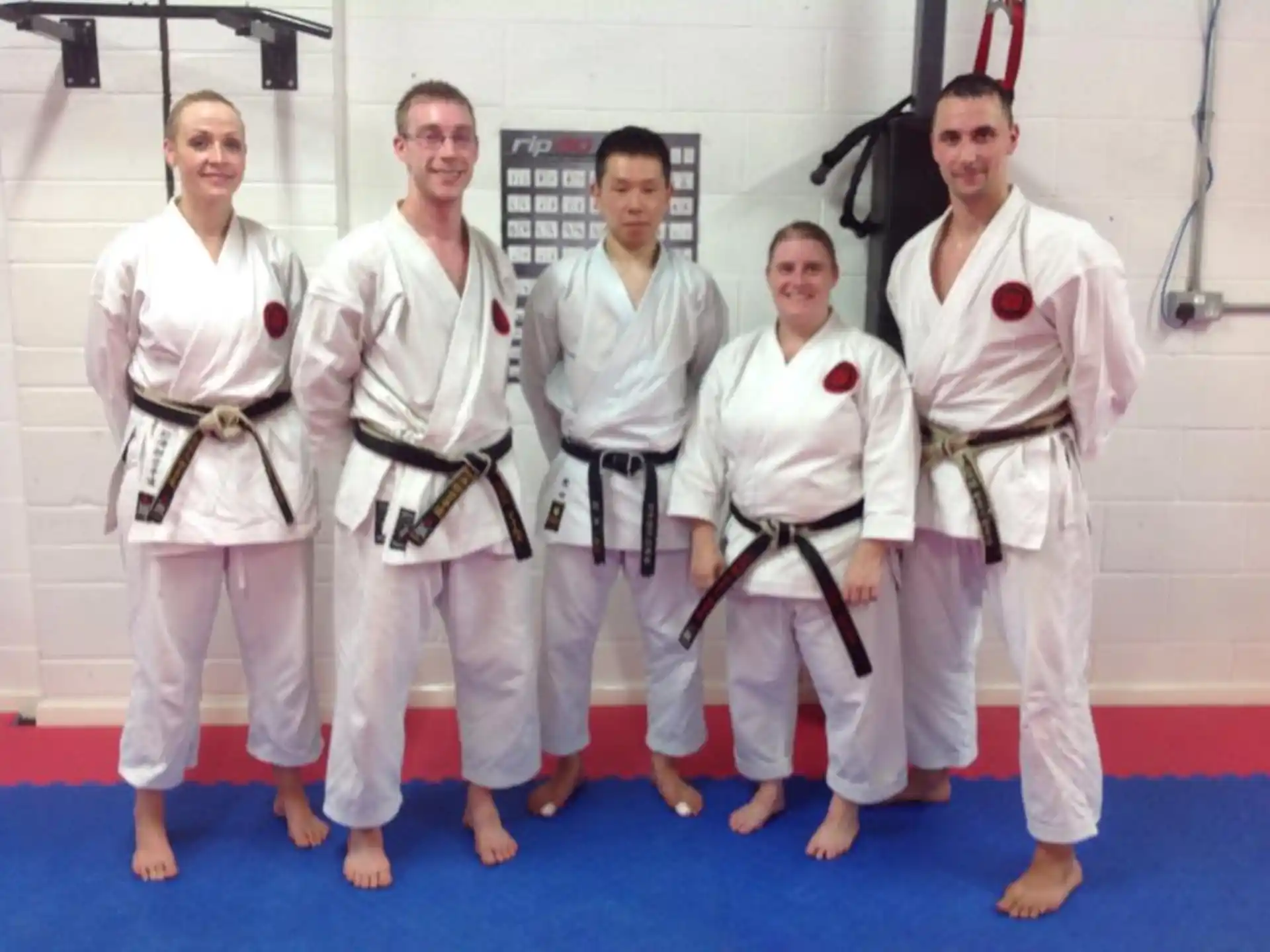 a group of people in karate uniforms