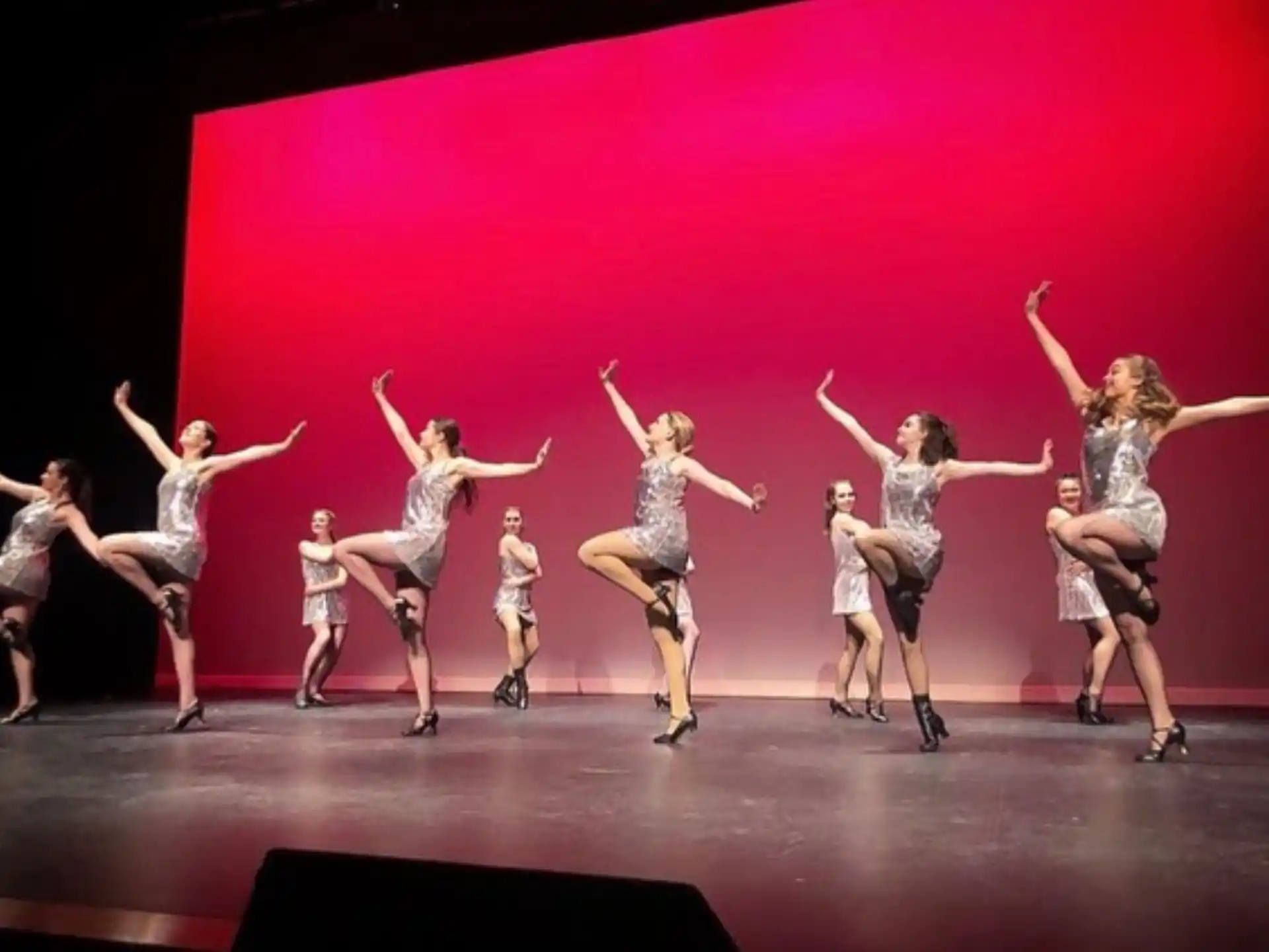 a group of women dancing on a stage