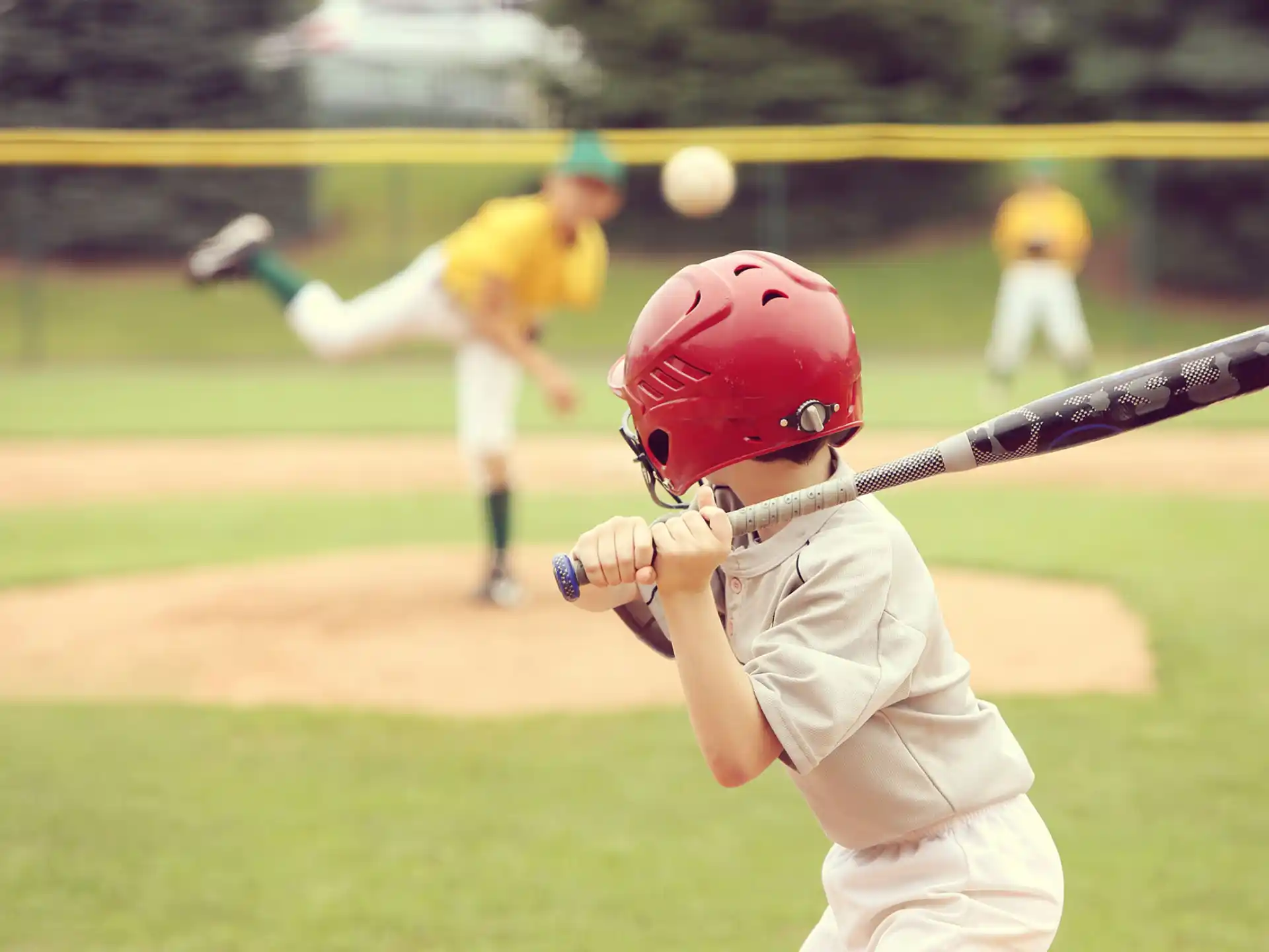a young boy playing baseball