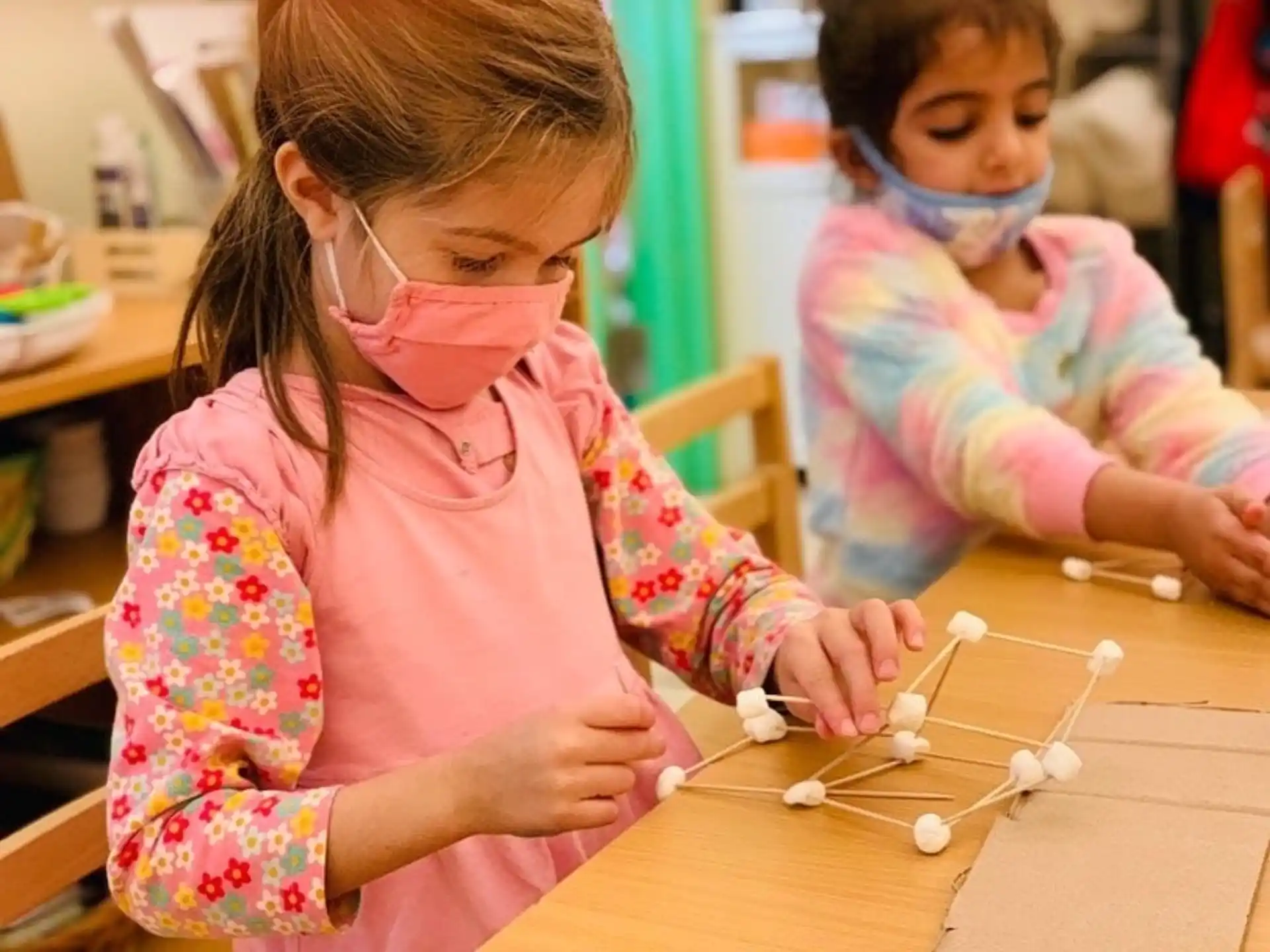 a young girl and a young girl painting