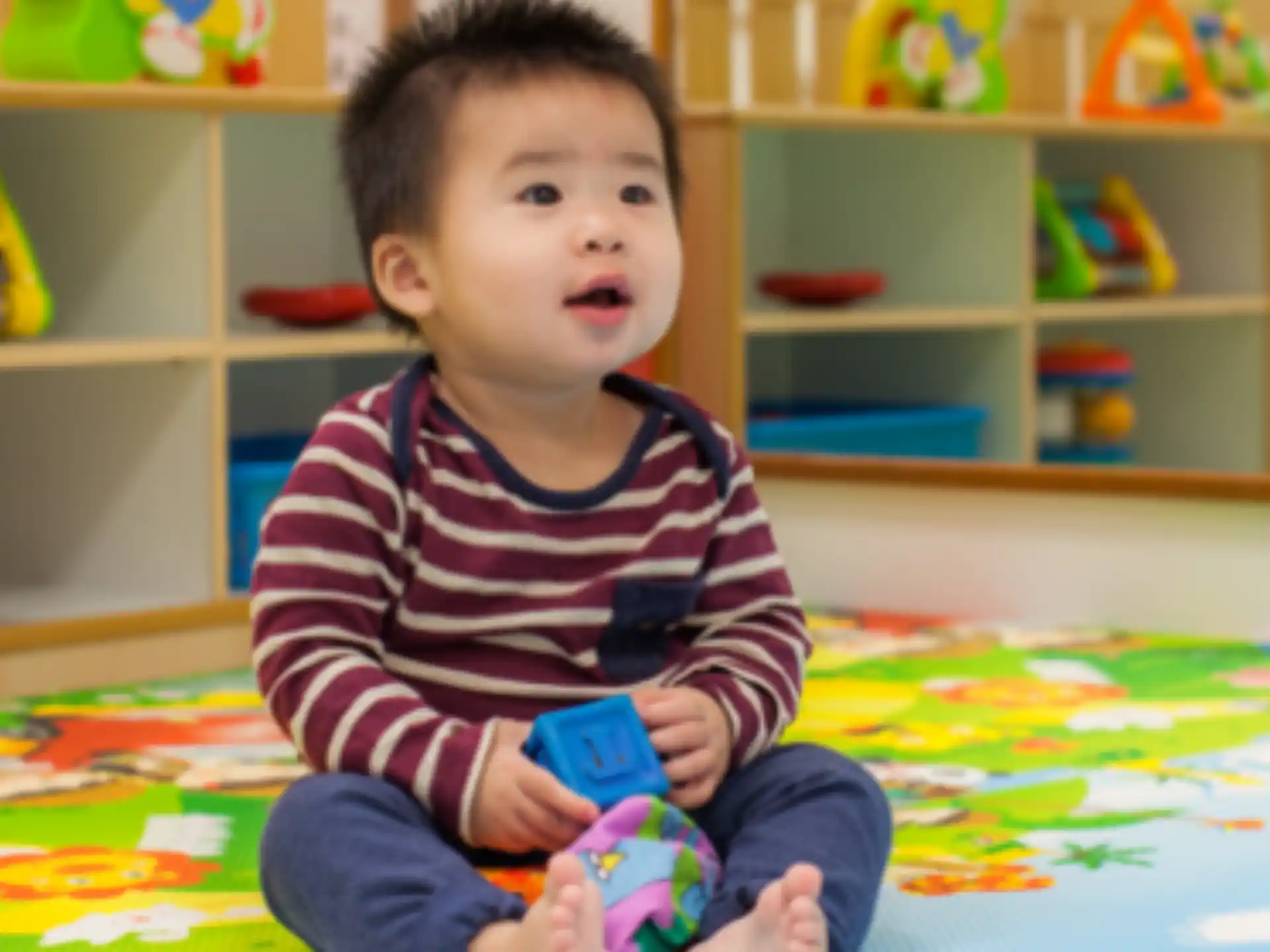 a baby sitting on the floor