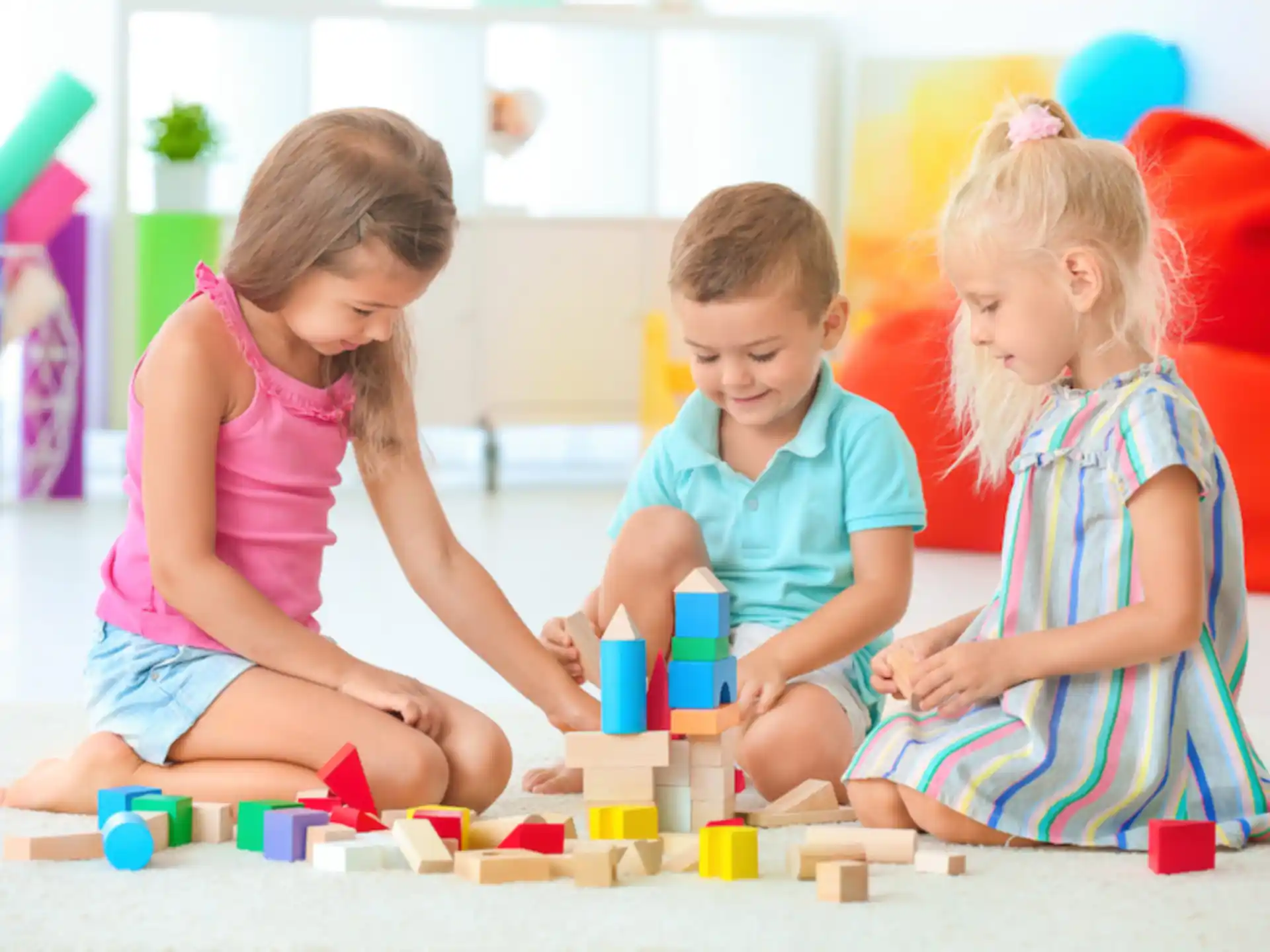 a group of children playing with toys