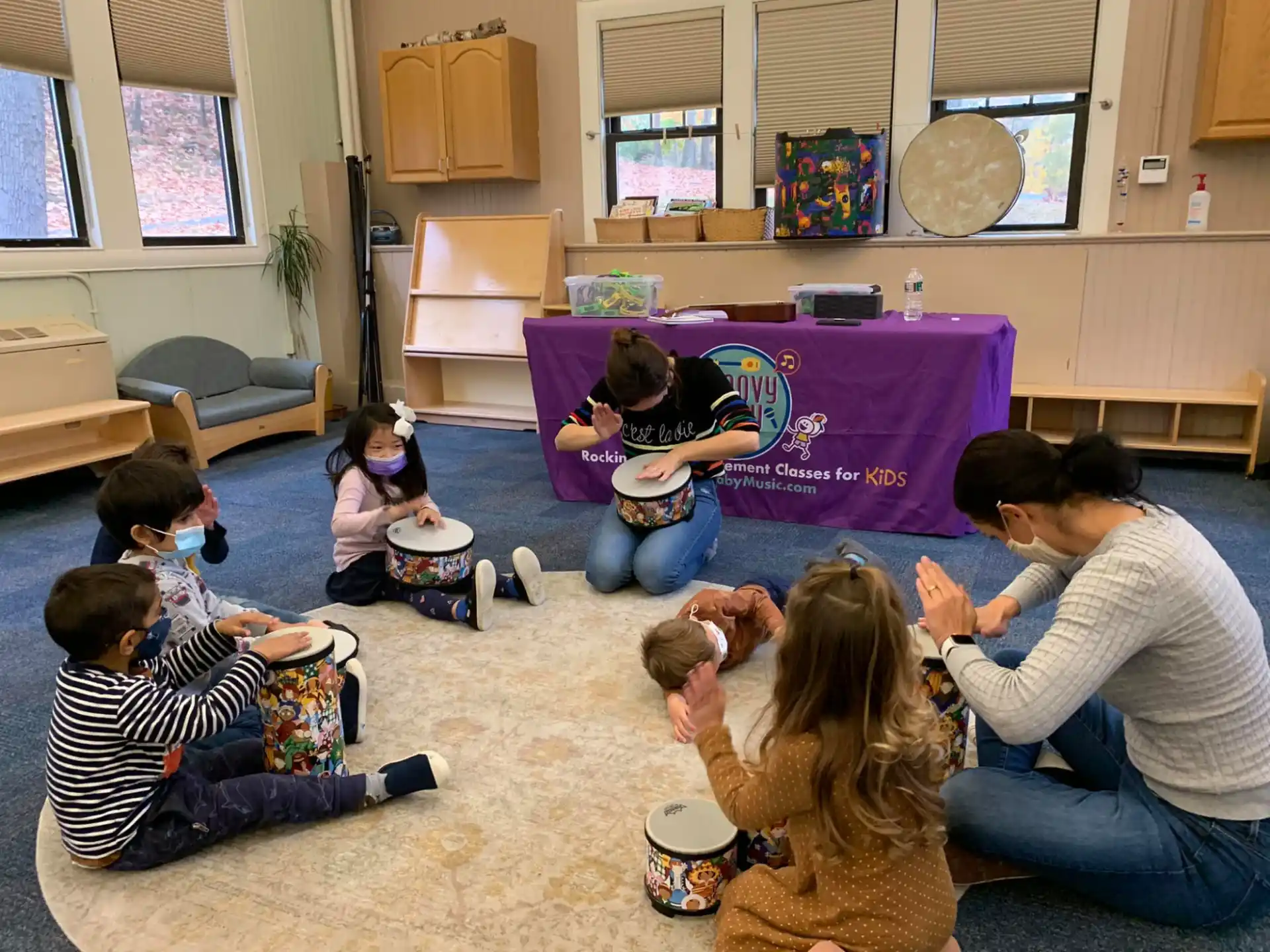 a group of people sitting on the floor playing a game