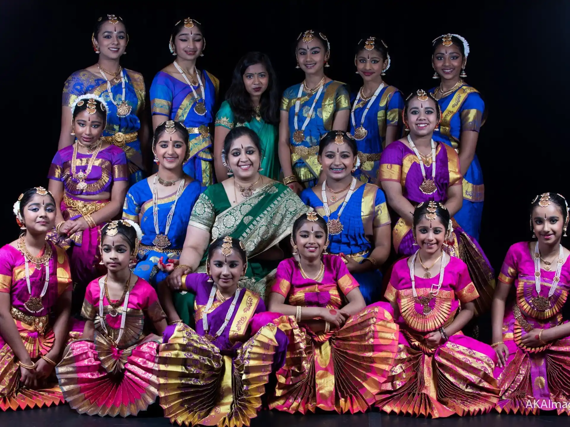 a group of women in colorful dresses