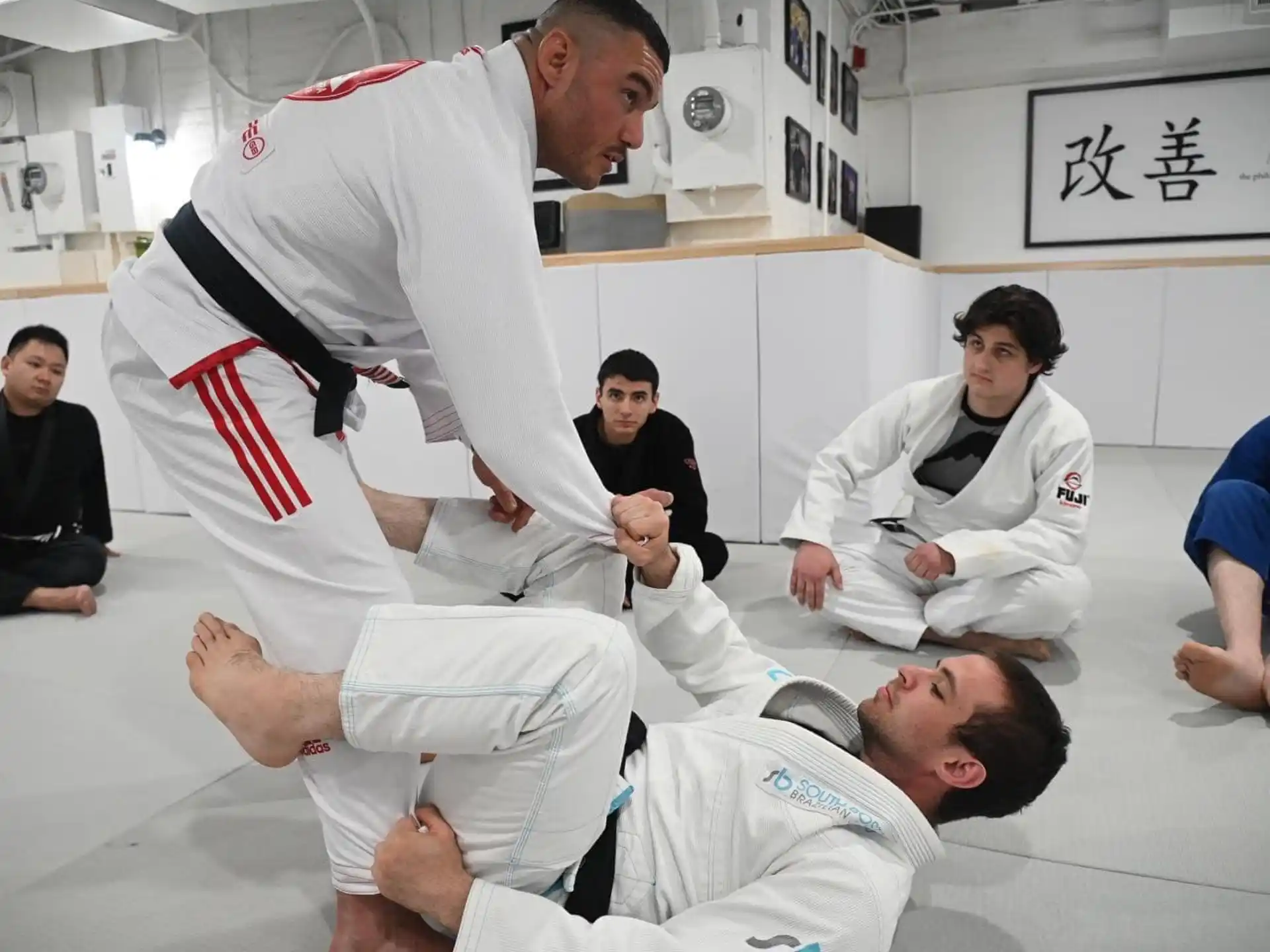 a group of men in karate uniforms