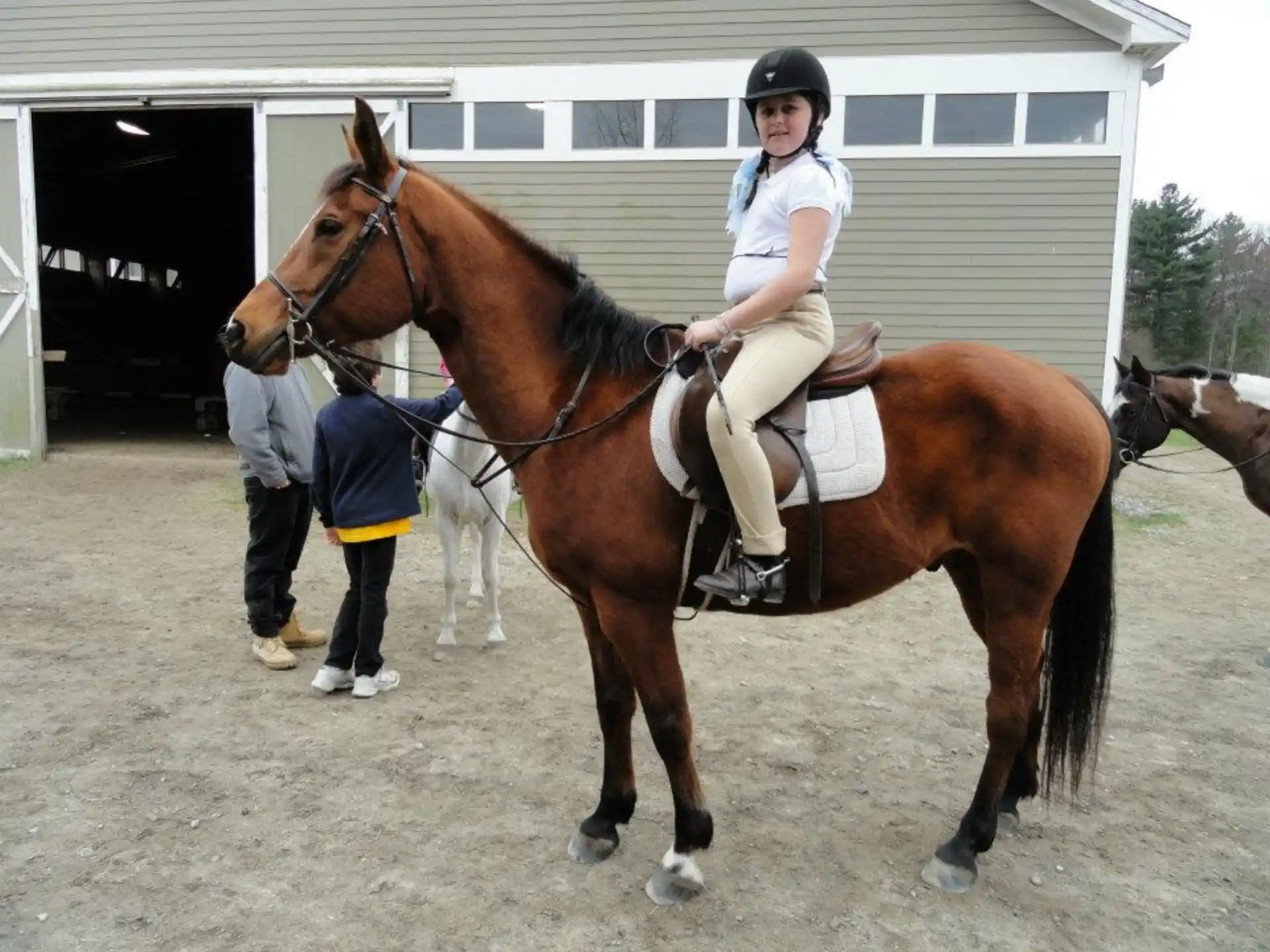a girl riding a horse
