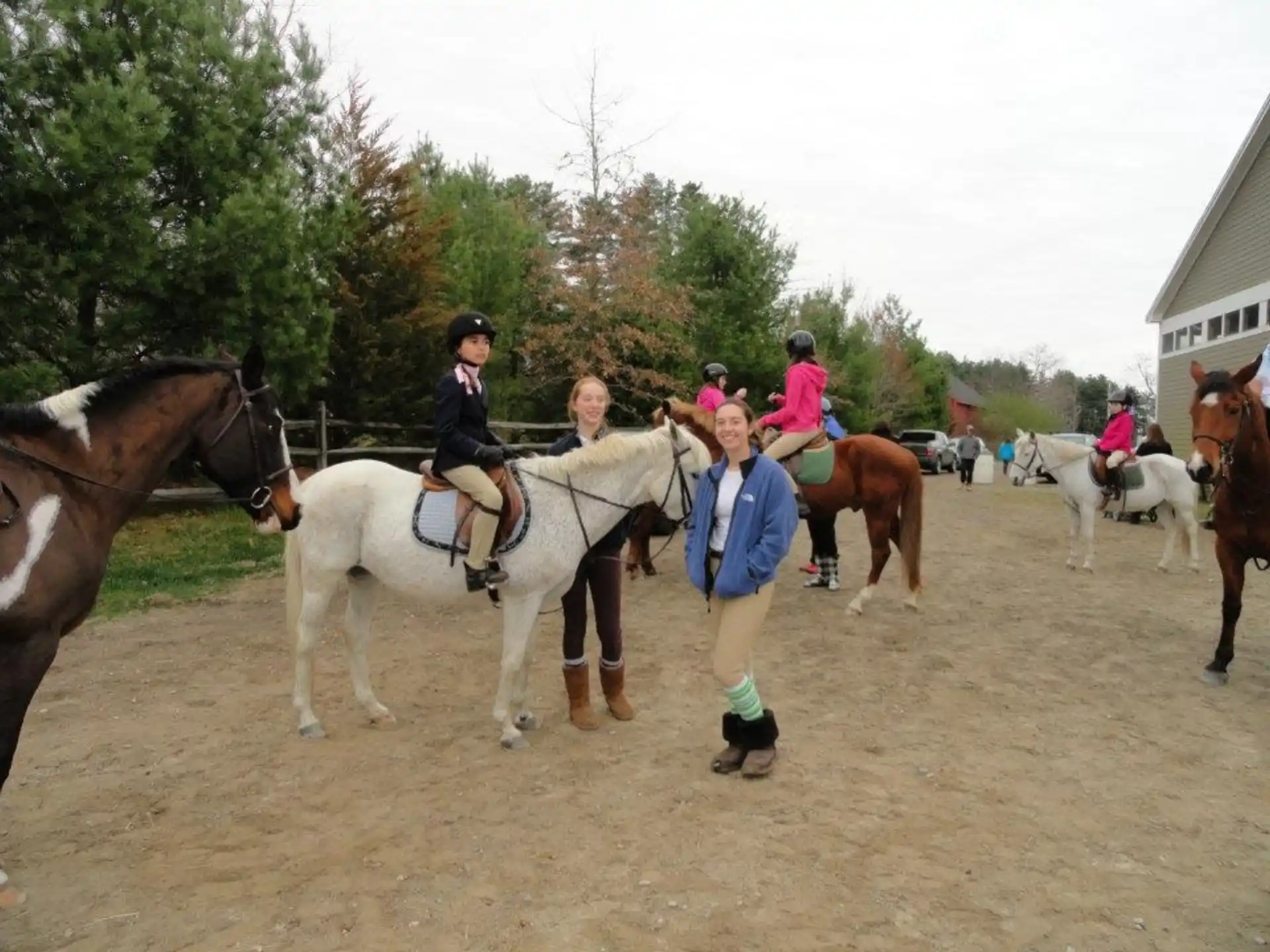 a group of people riding horses