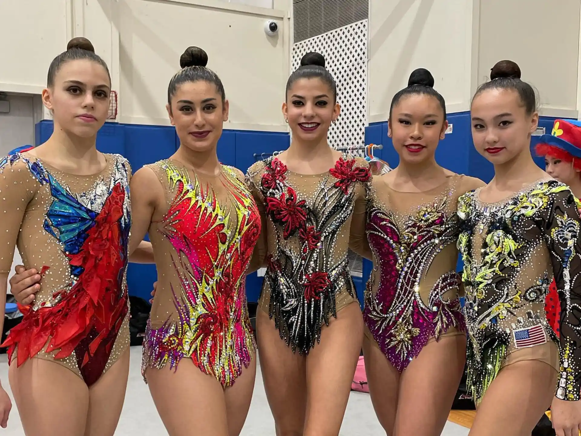 a group of women in colorful dresses