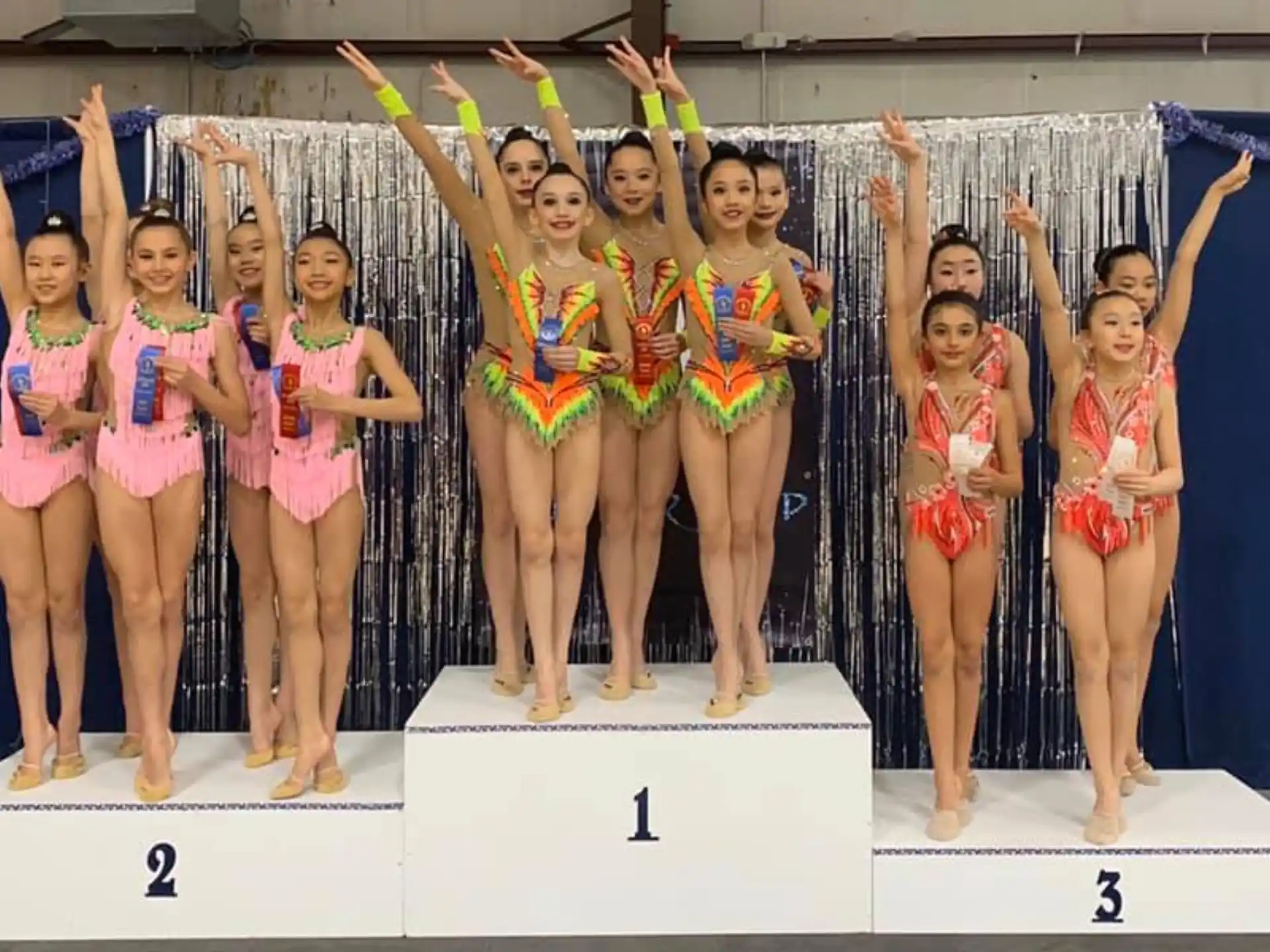 a group of women in swimsuits posing for a photo