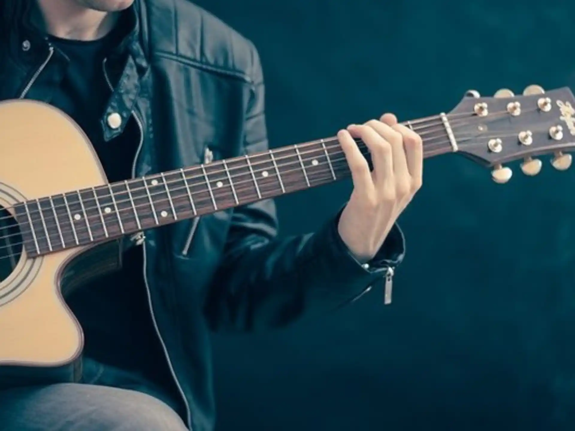 a person playing a guitar