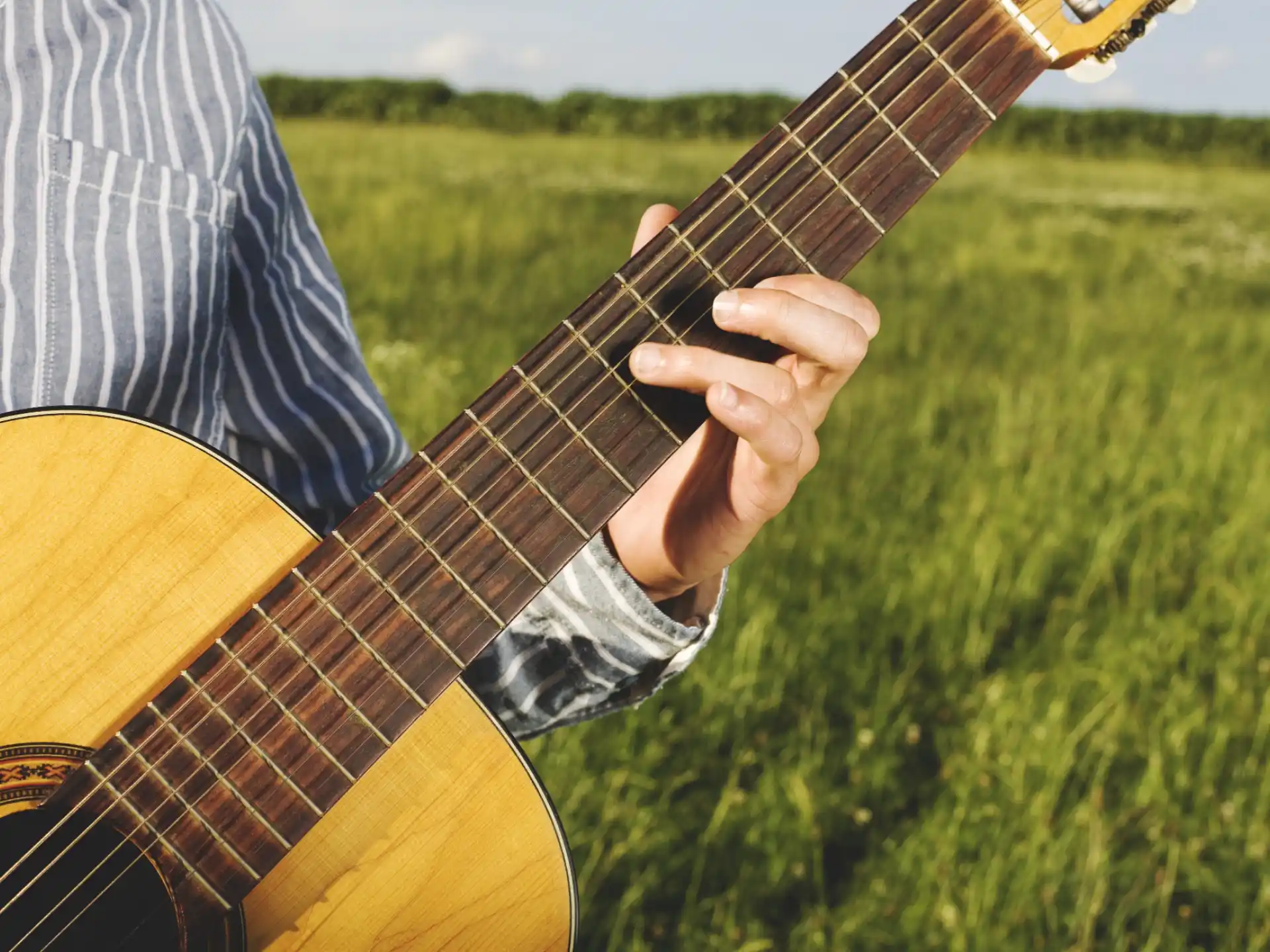a person playing a guitar