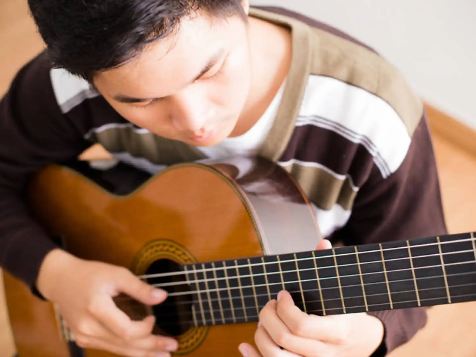 a person playing a guitar