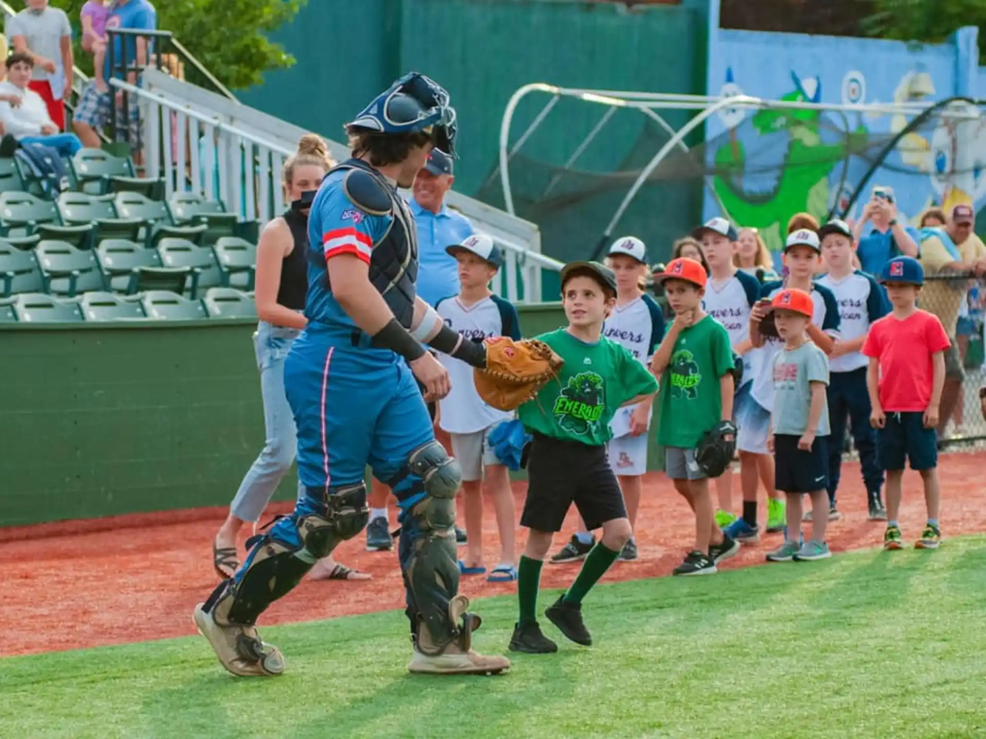 a baseball player running to home plate