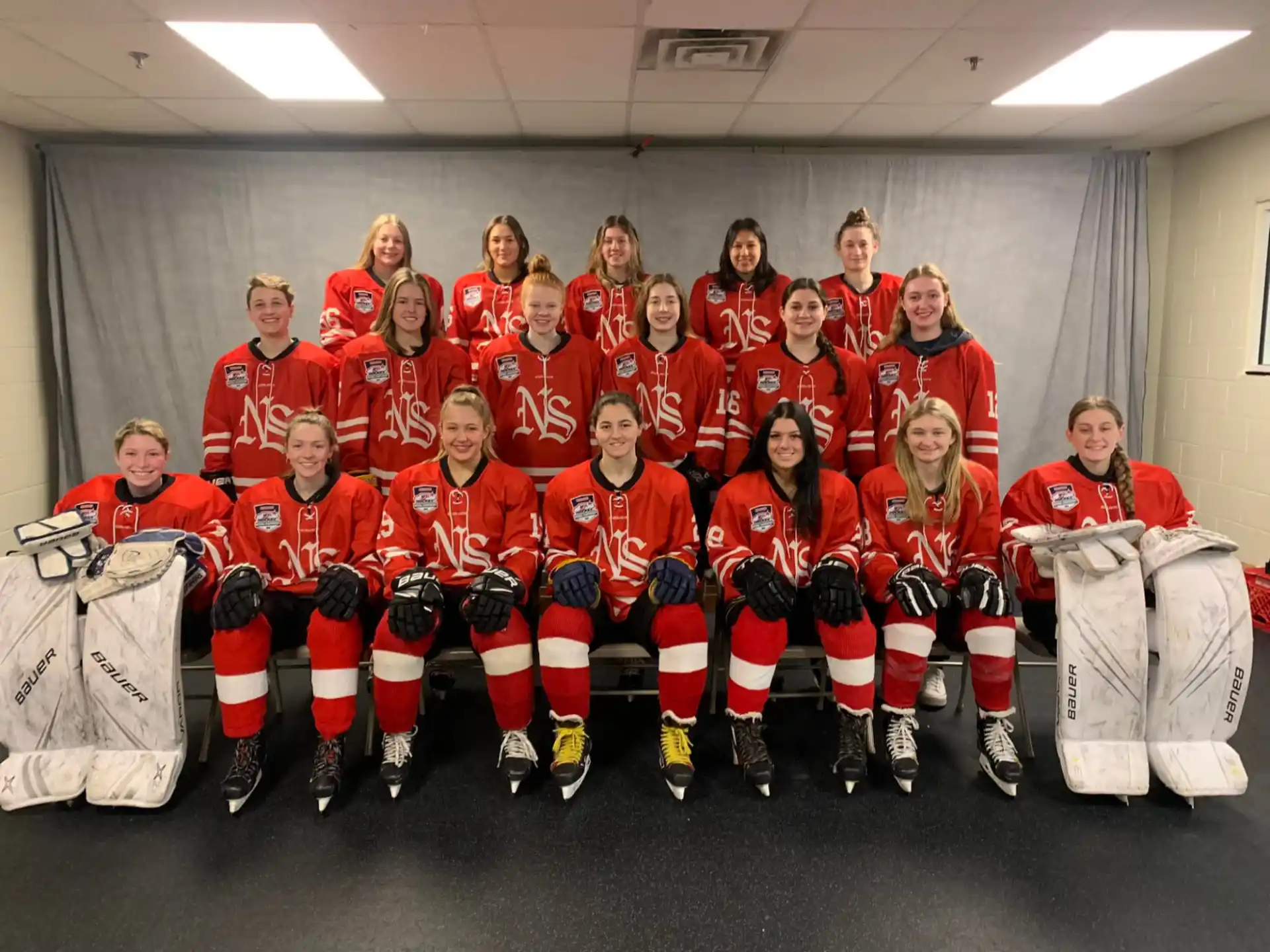 a group of people in hockey uniforms