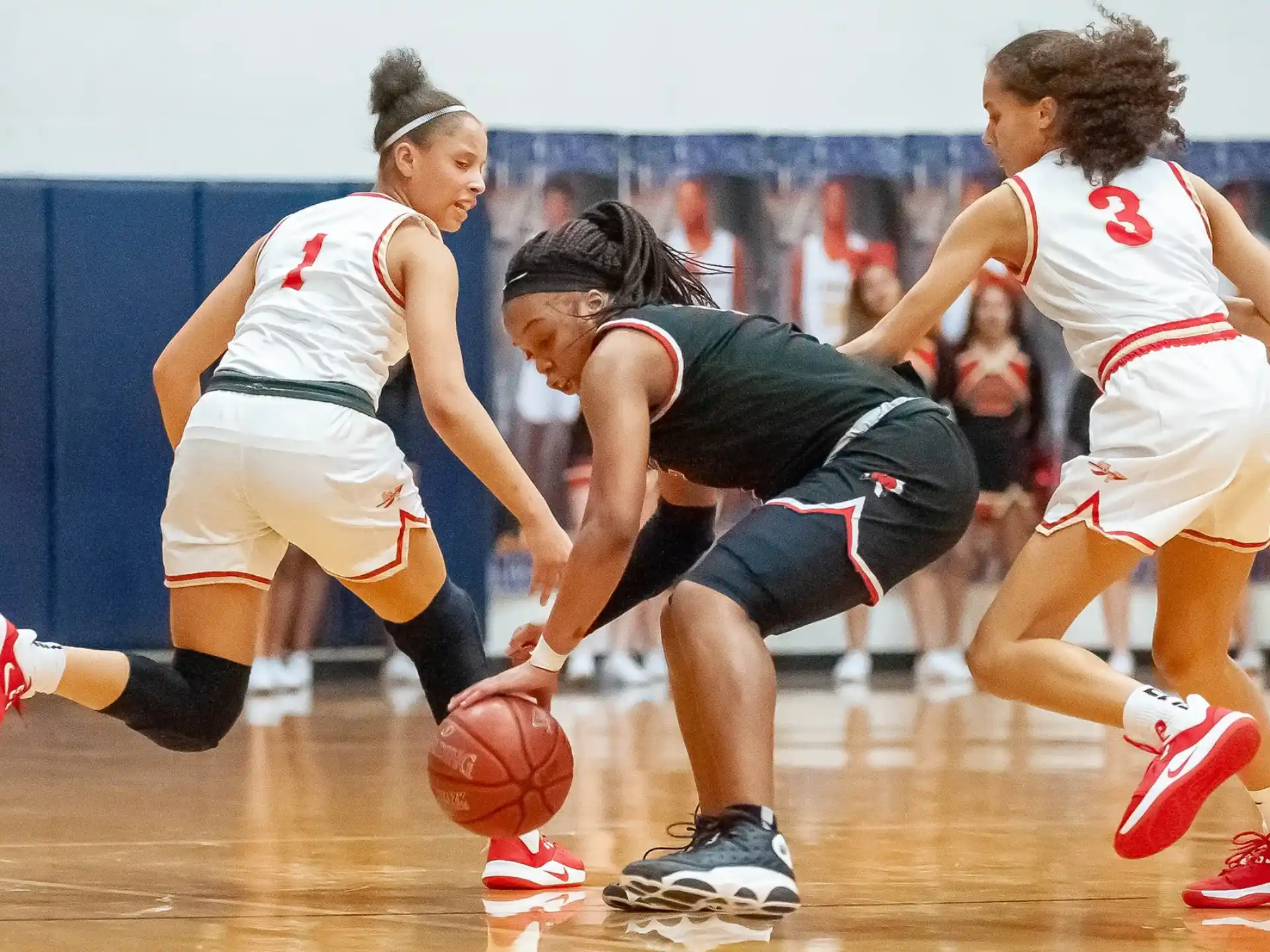 a group of women playing basketball