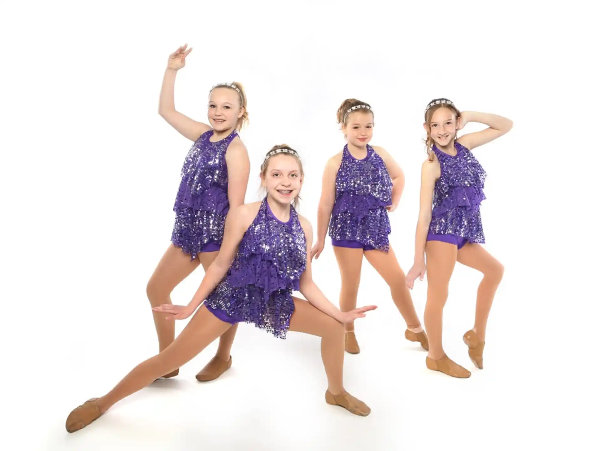 a group of girls in dresses