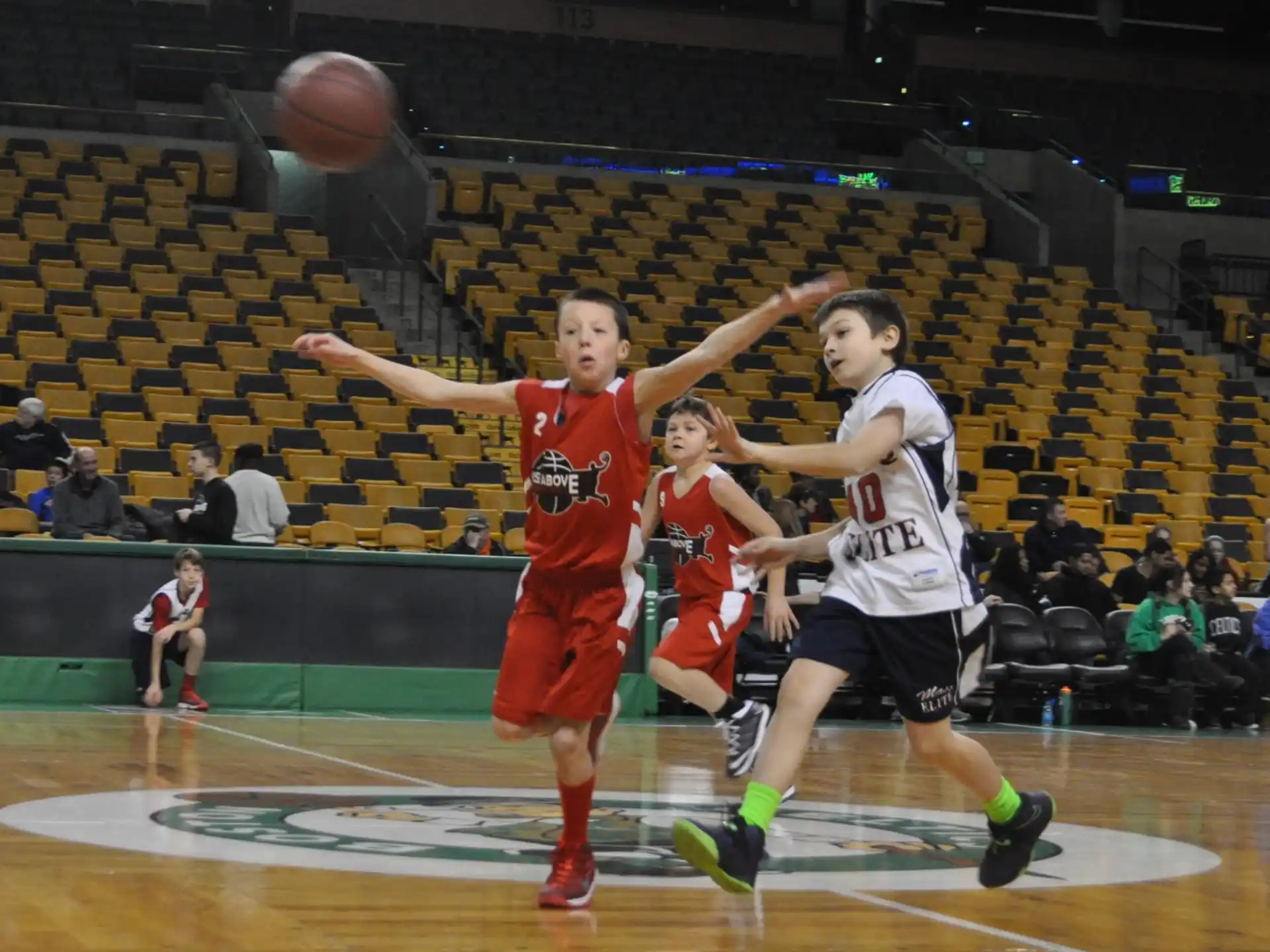 a group of people playing basketball