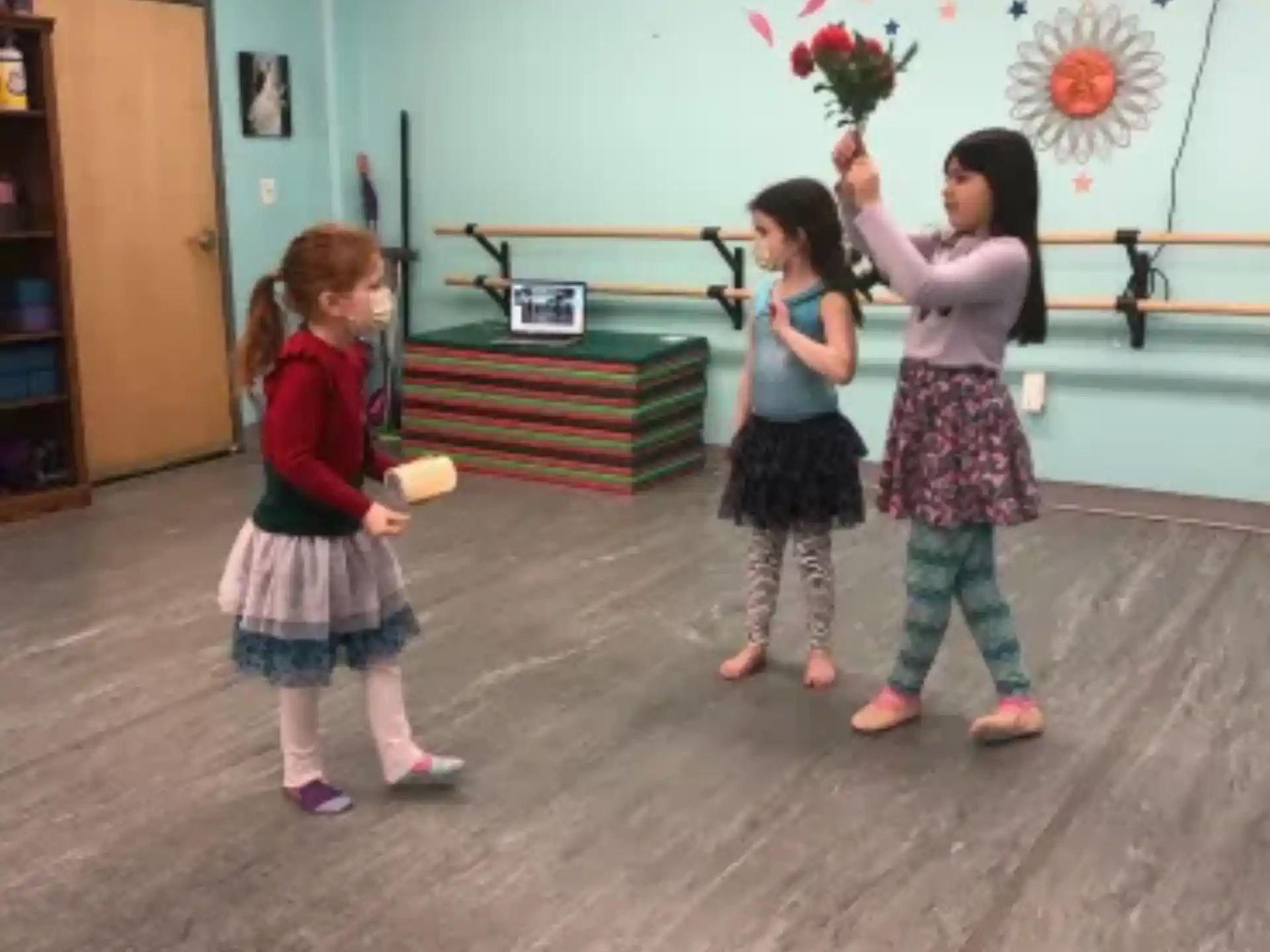 a group of children holding flowers