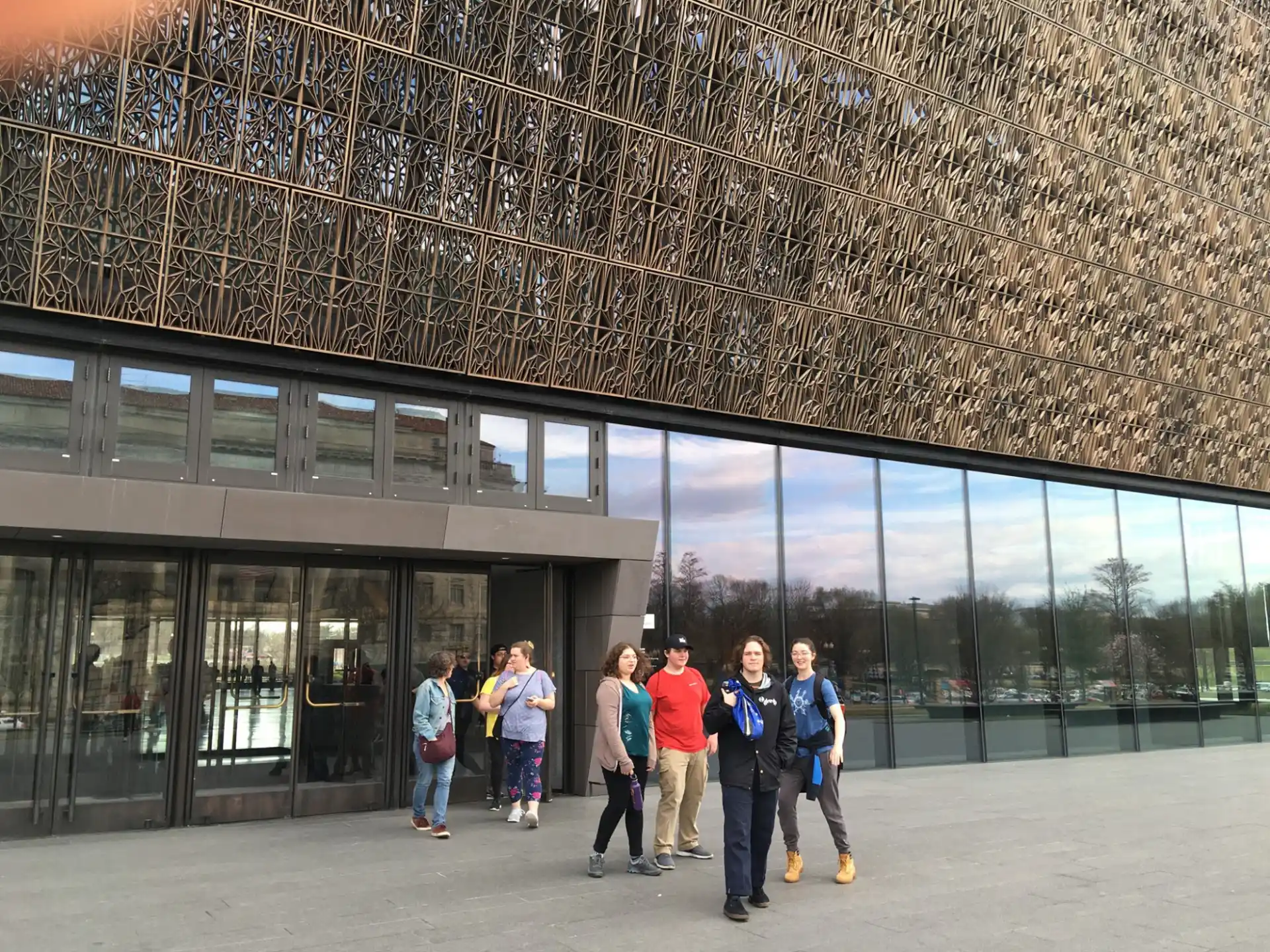 a group of people standing outside a building