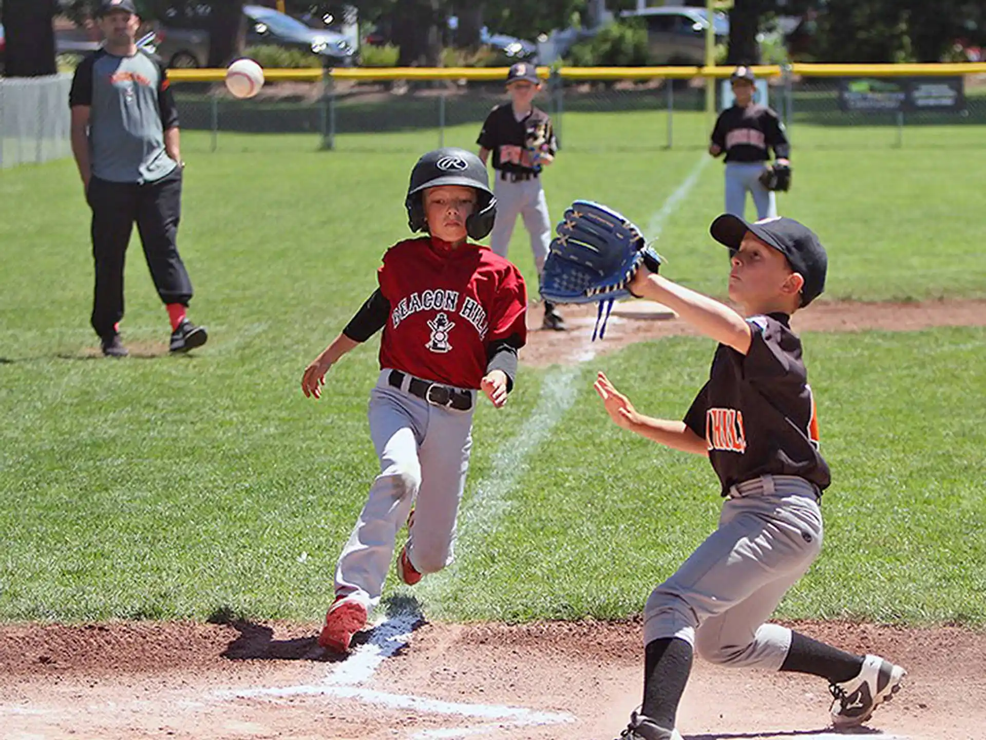 kids playing baseball on a field
