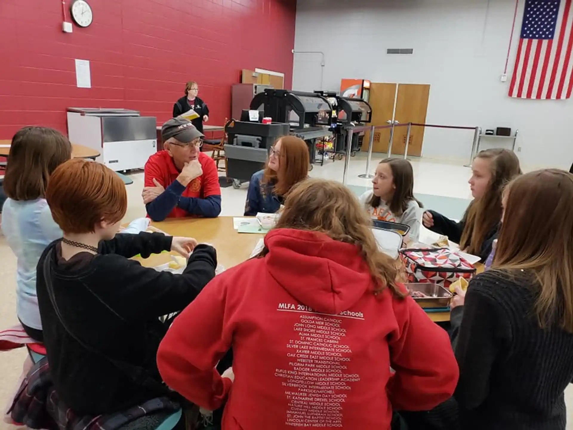 a group of people sitting at a table