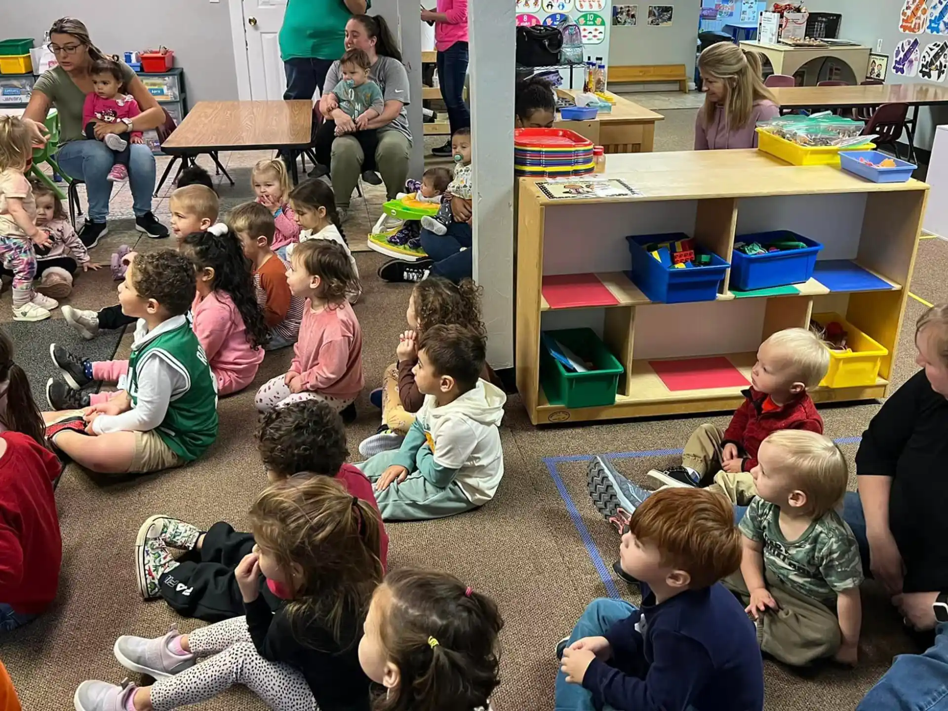 a group of children sitting on the floor