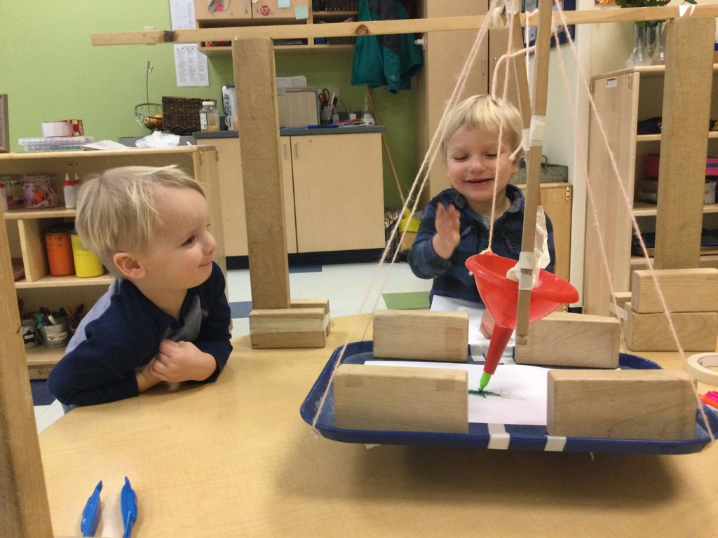a couple of kids playing with building blocks