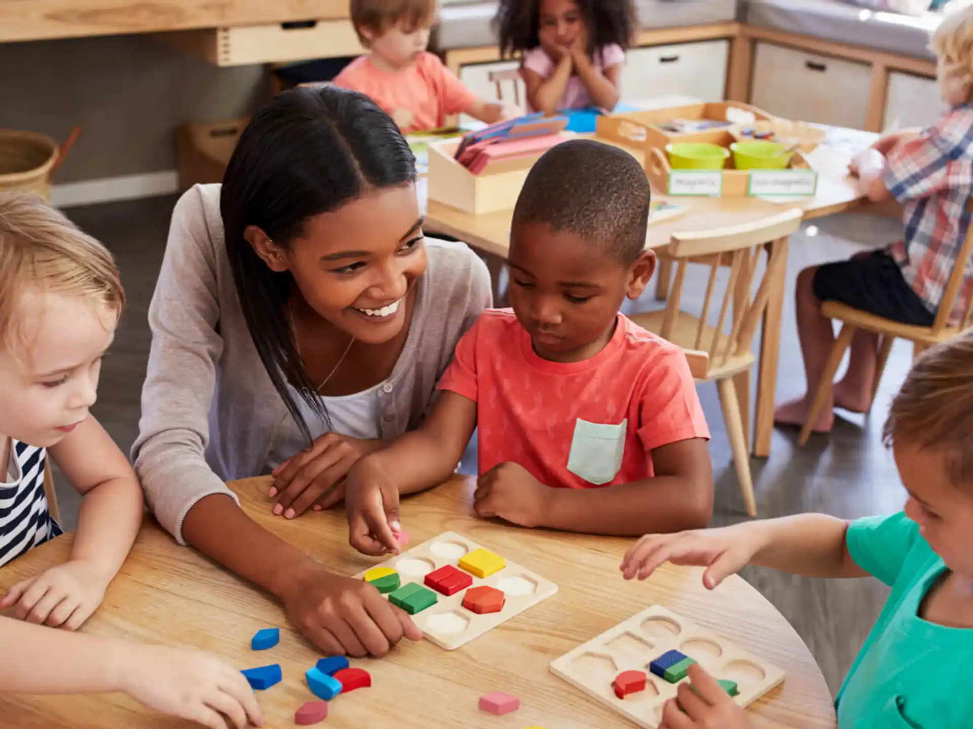 a person and several children playing with toys