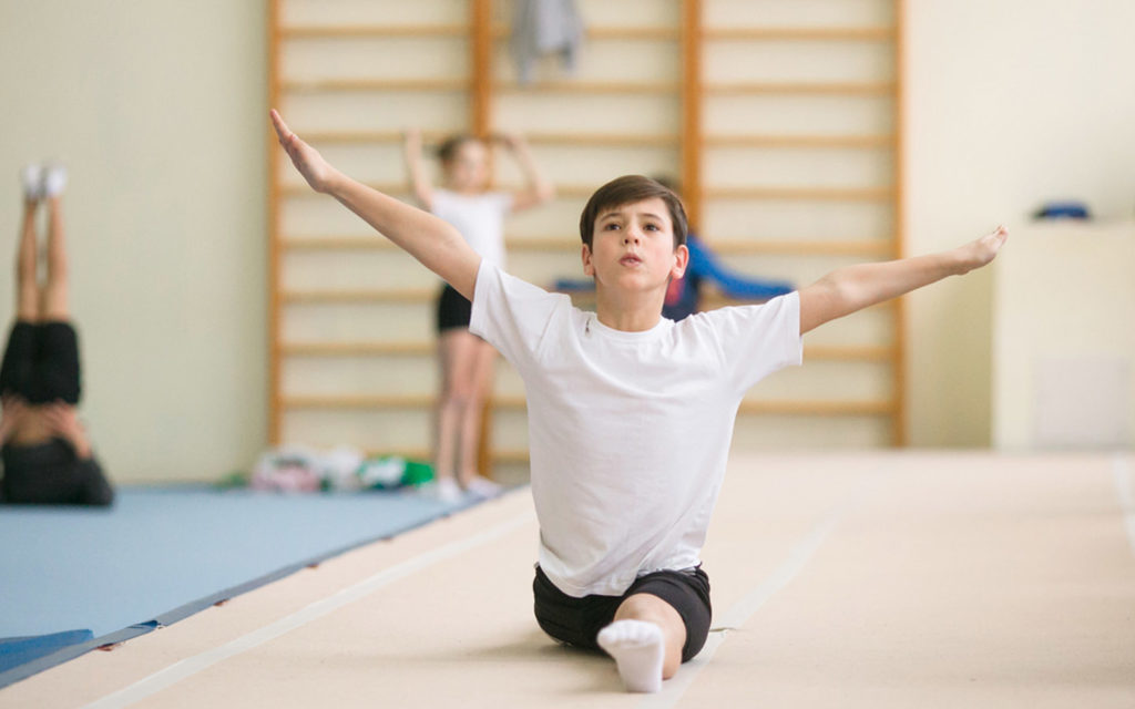 a boy with his arms up