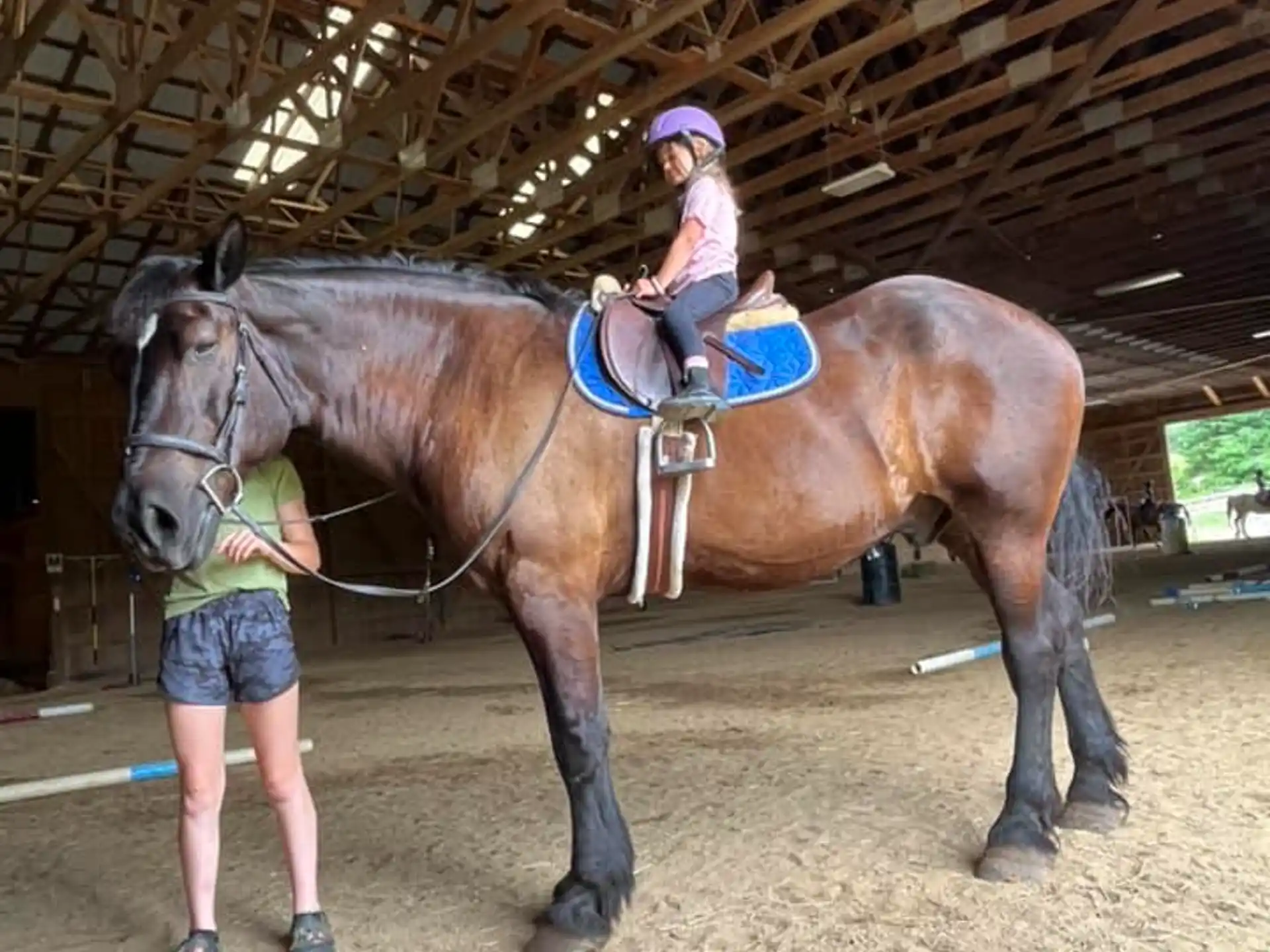 a girl riding a horse