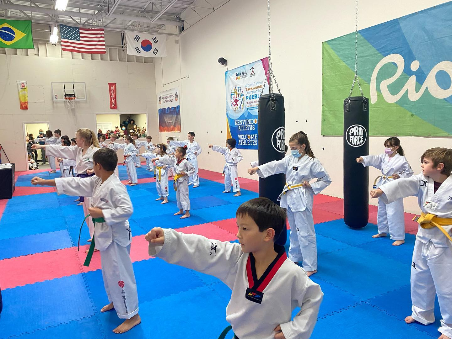 a group of people in karate uniforms