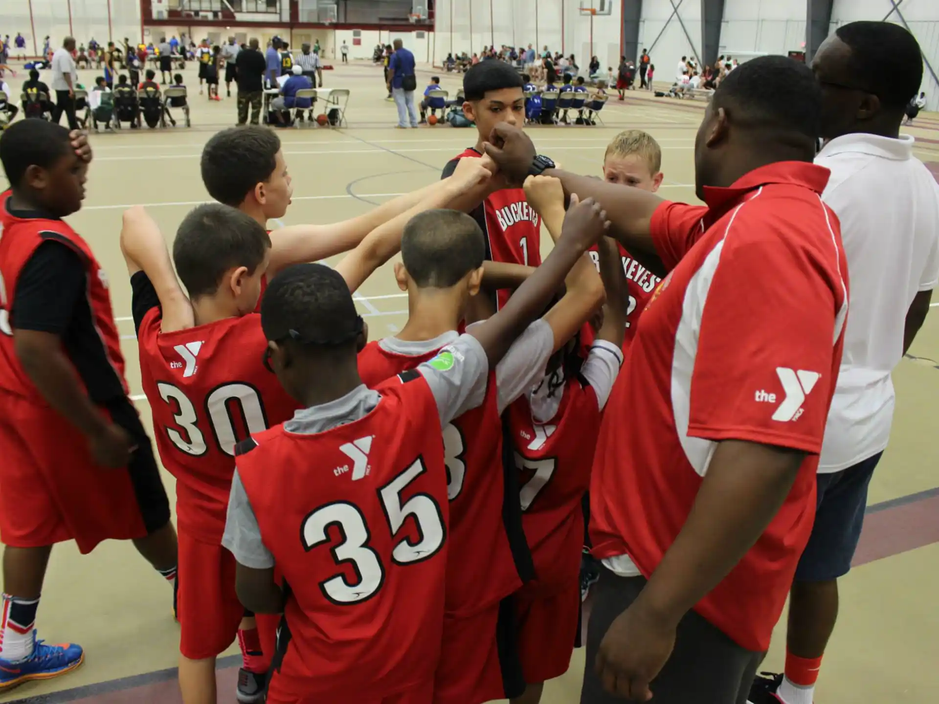 a group of boys in red uniforms