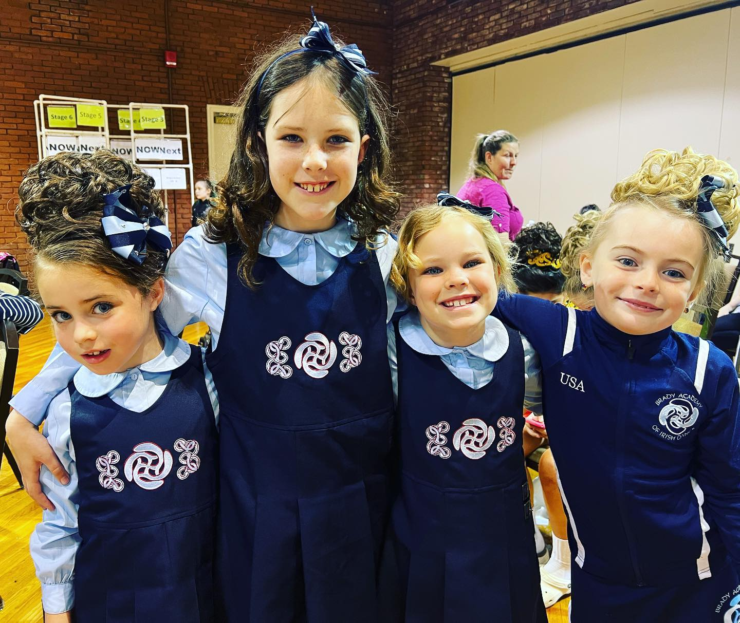 a group of girls in blue and black uniforms