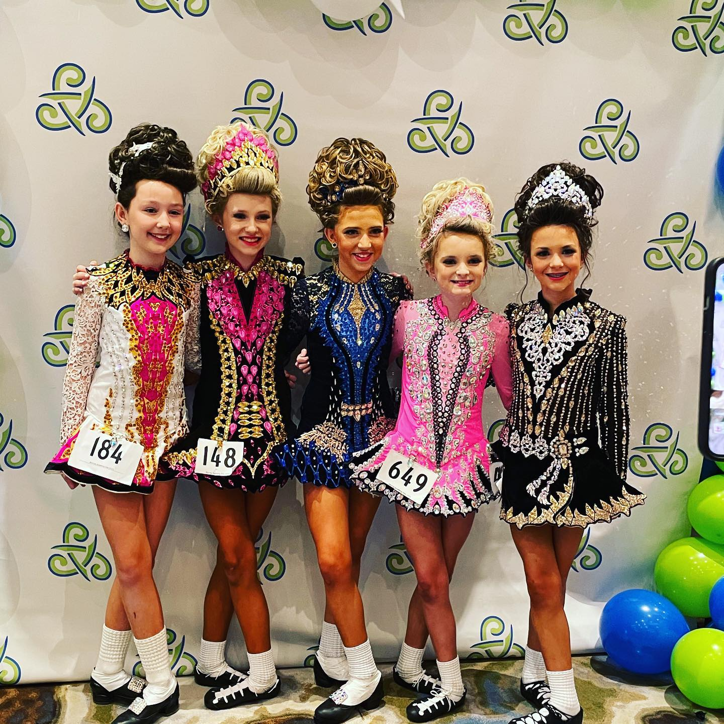 a group of girls wearing clothing