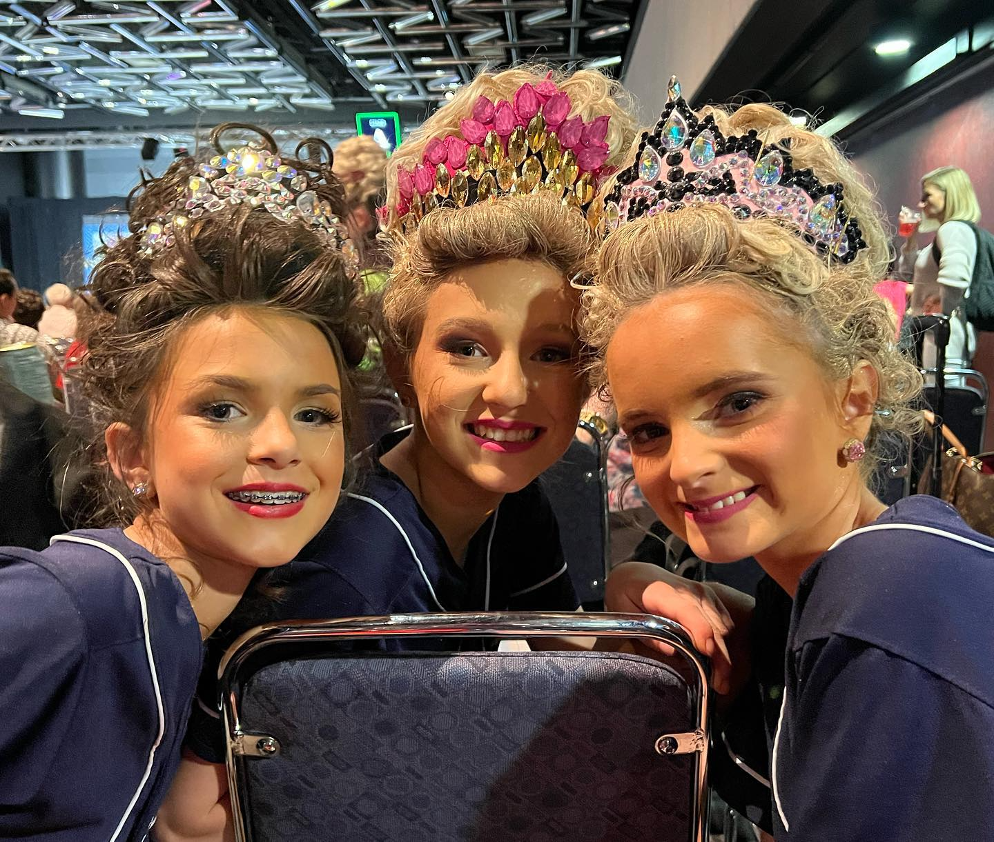 a group of girls wearing crowns
