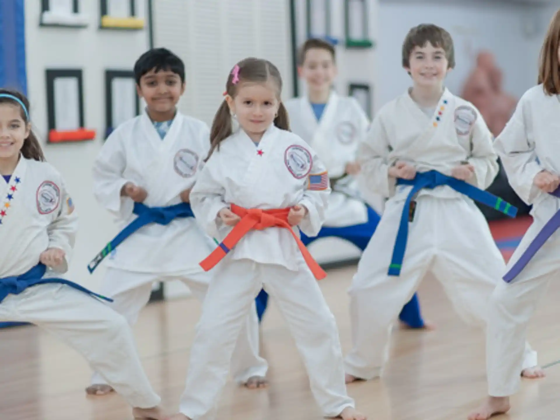 a group of people in karate uniforms