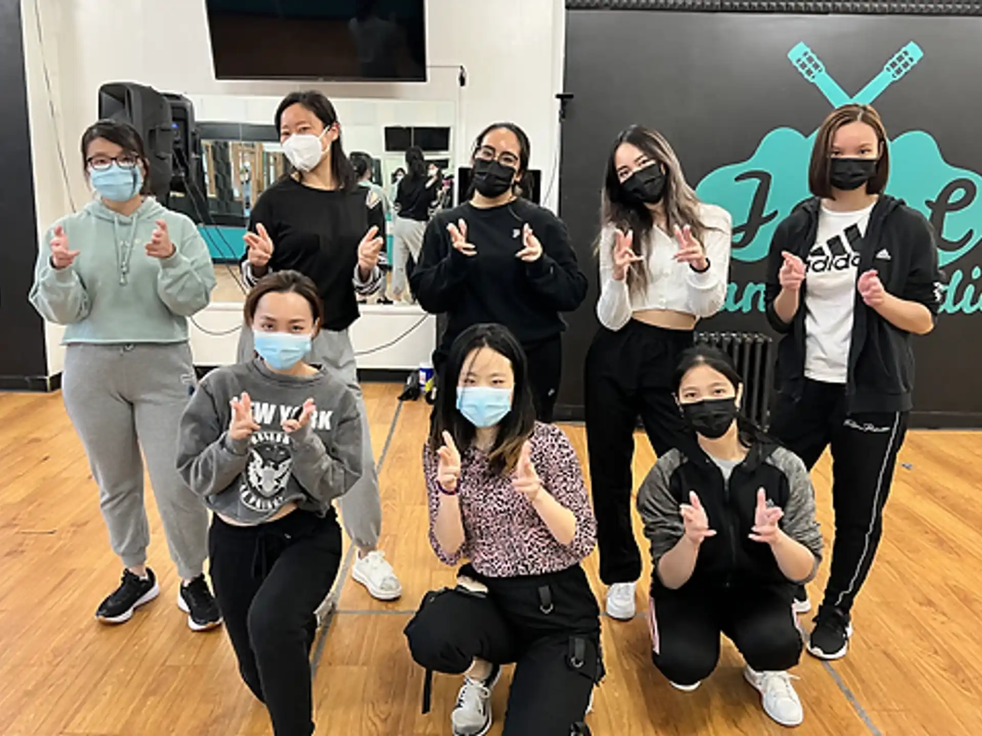 a group of people wearing masks