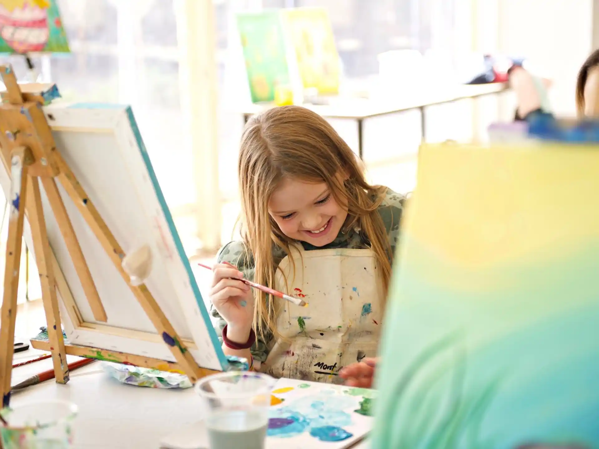 a young girl painting