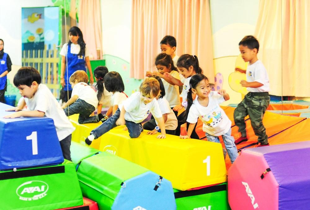 a group of children playing on a playground