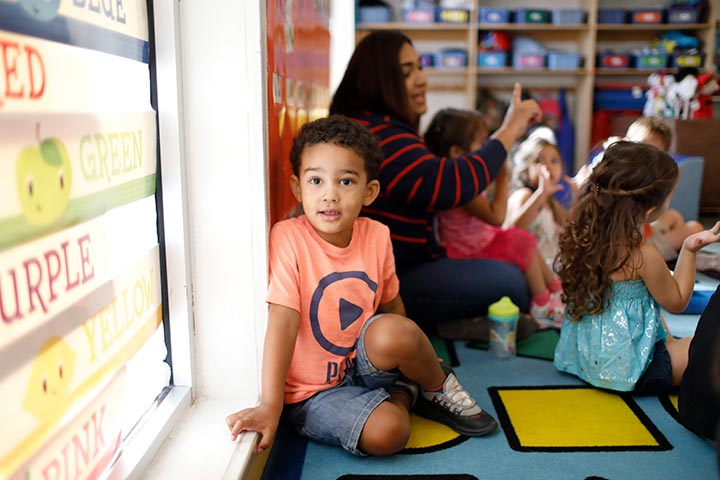 a group of children sitting on the floor