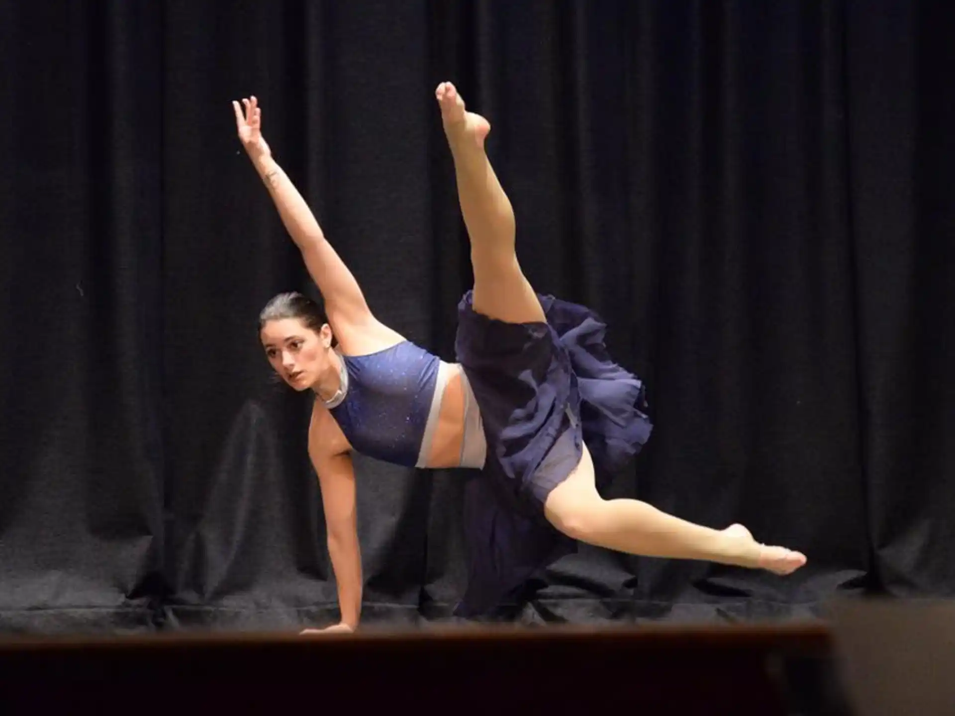 a woman dancing on a stage