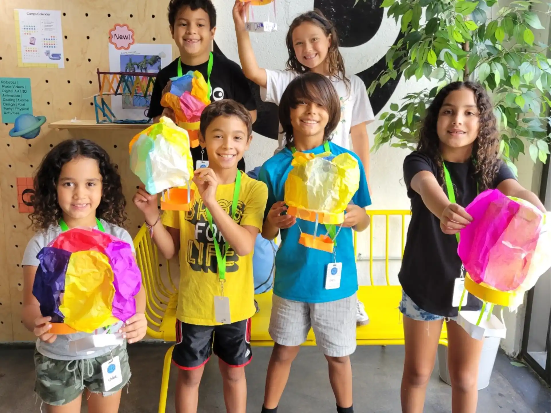 a group of children holding balloons