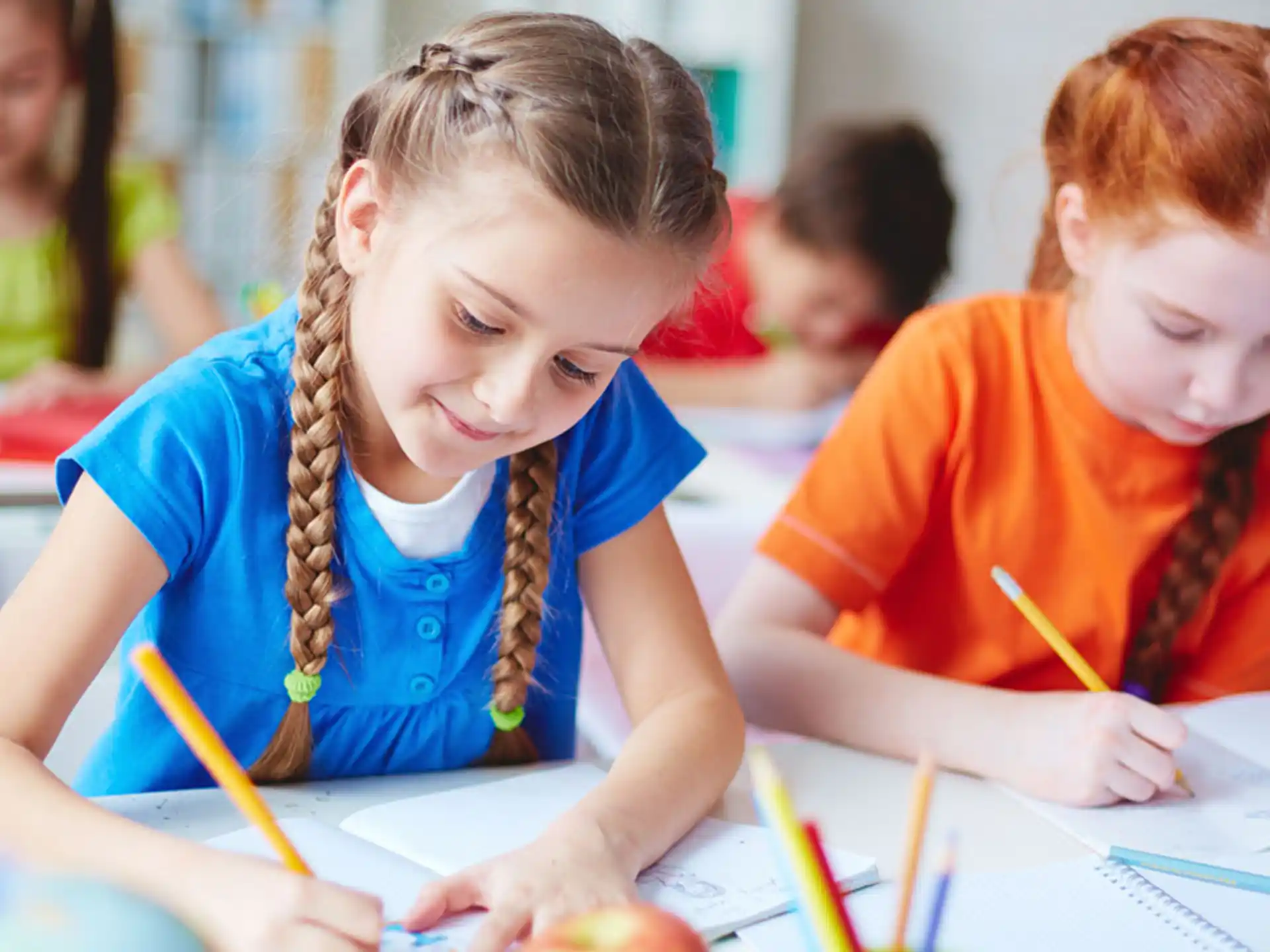 a few children sitting at a table
