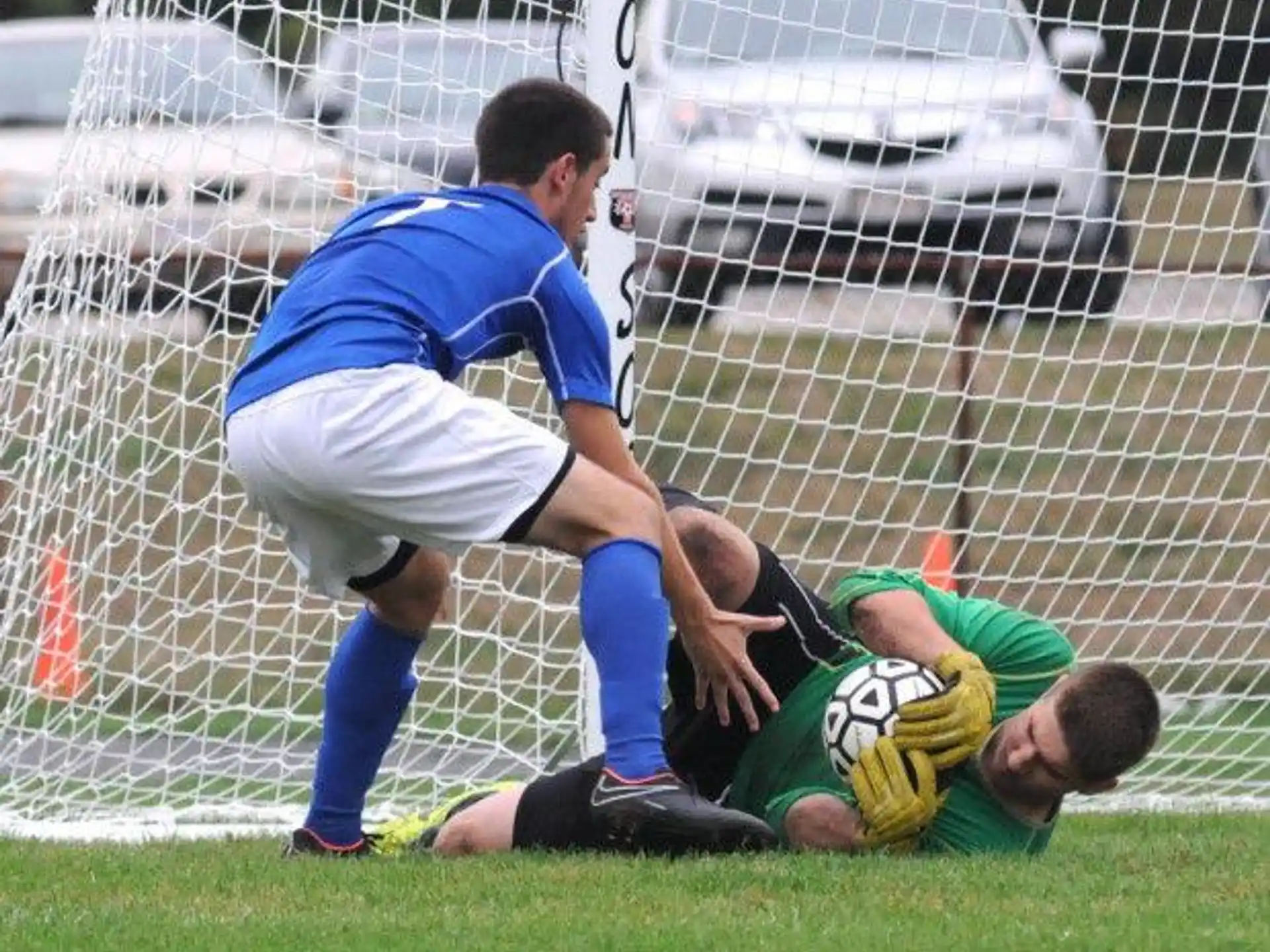 a football player falling over a football player