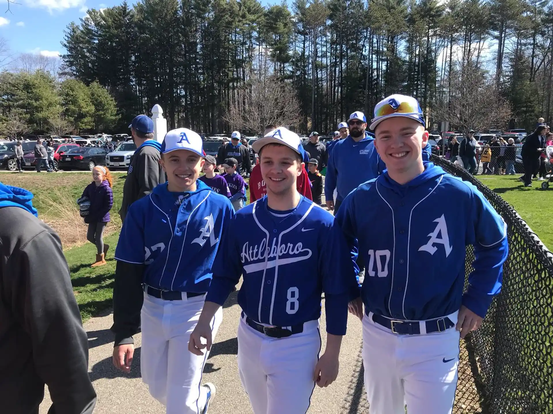 a group of people wearing baseball uniforms
