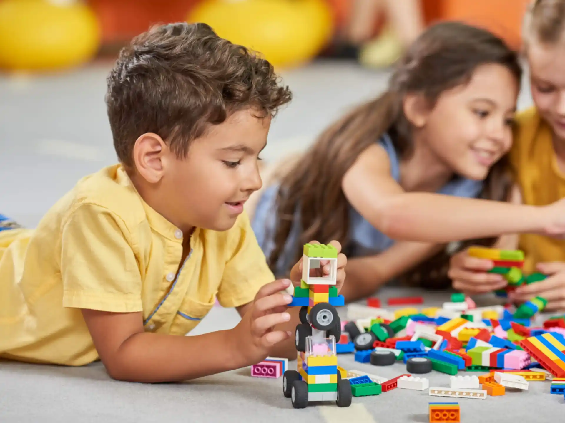 a group of children playing with toys