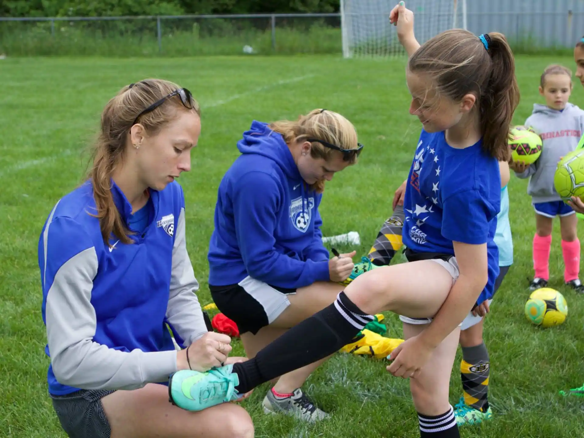 a group of girls playing football